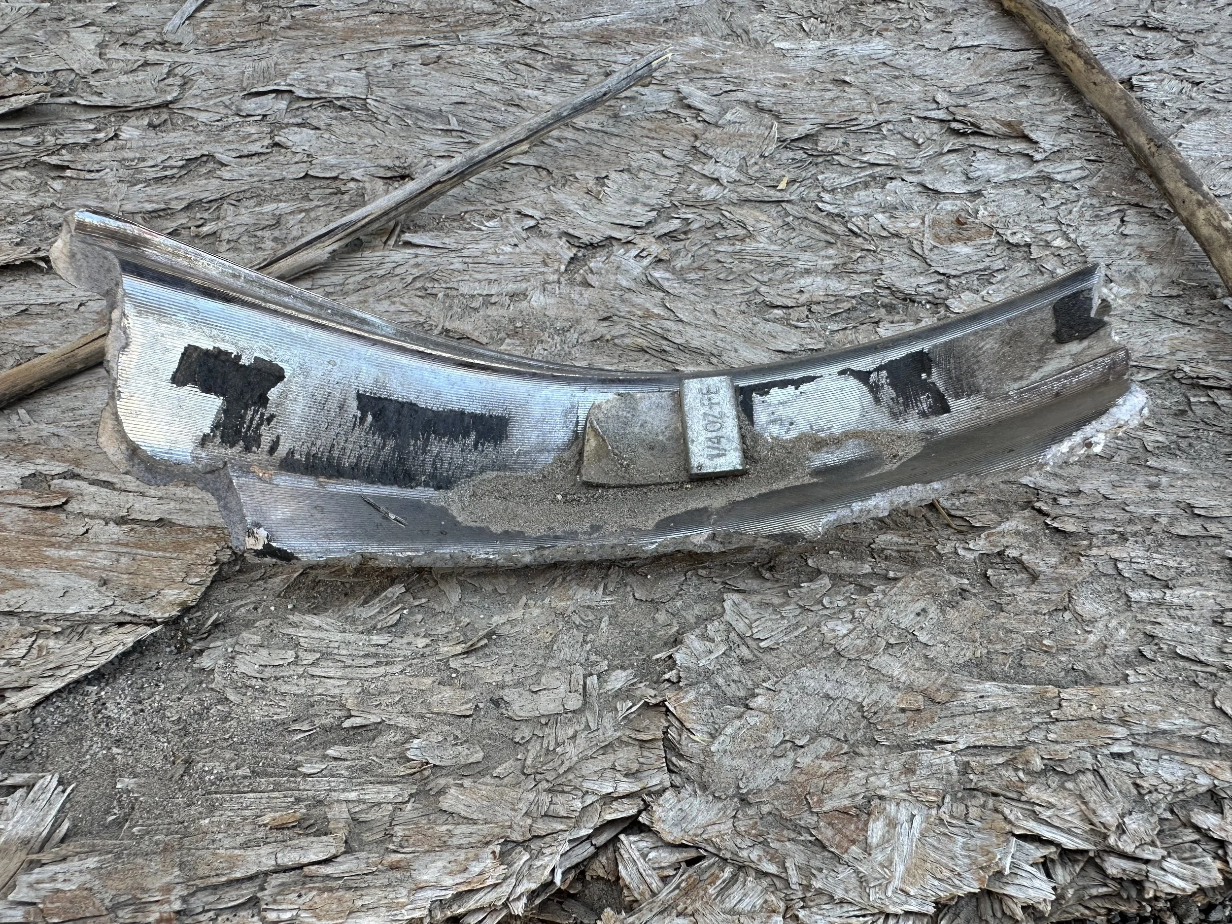 A car part on an OSB board.