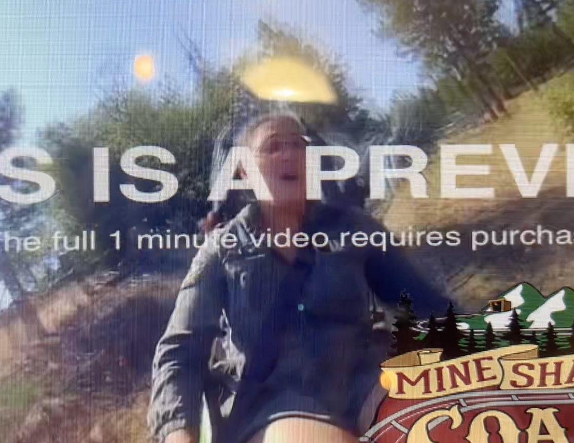 A woman has her mouth open seat belted to a slide with, This Is A Preview, written on top.