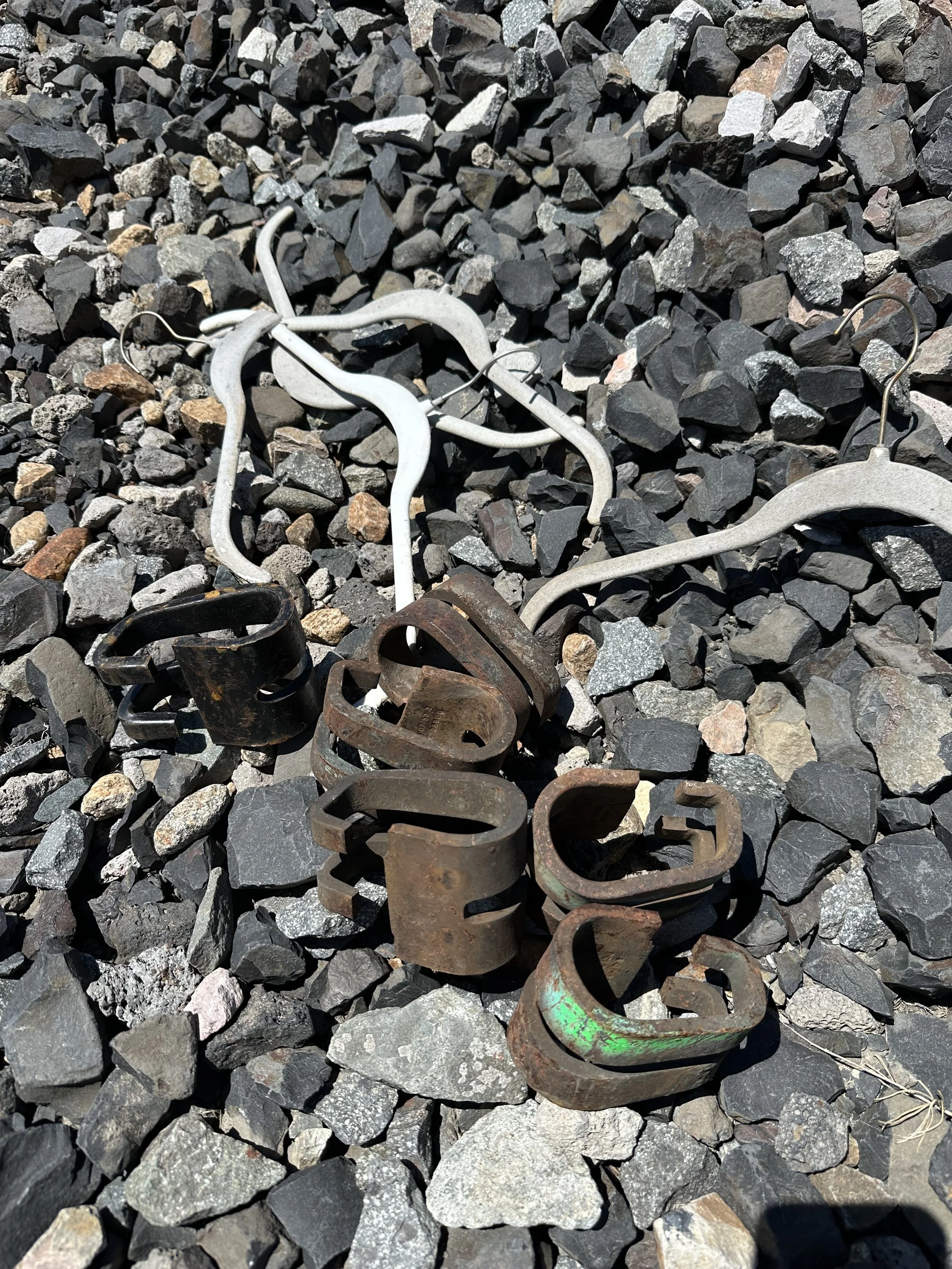 Plastic hangers, carbon steel railroad tie braces.