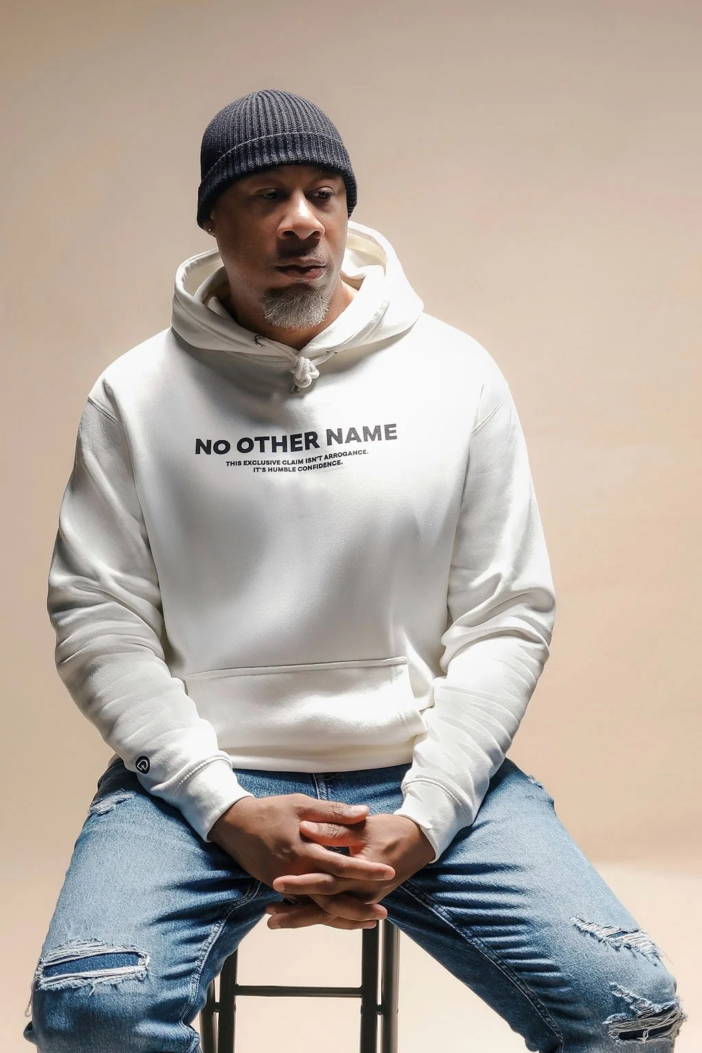 Model wearing off‑white NO OTHER NAME Christian hoodie by  DIGNITY × WORTH