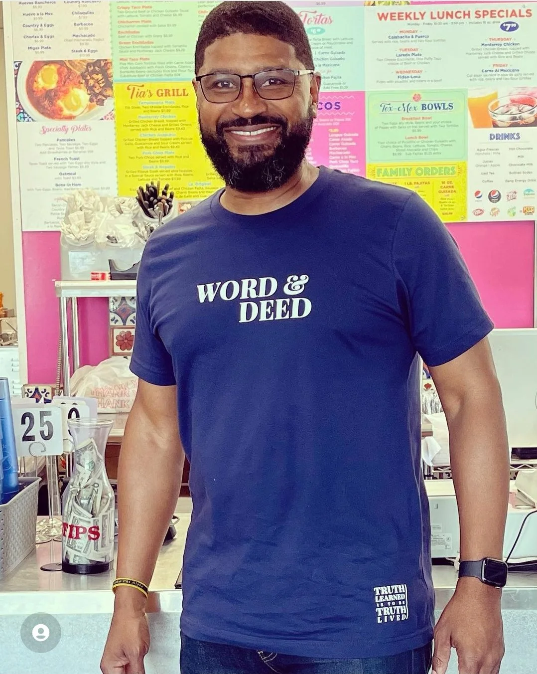 Man in unisex WORD & DEED shirt - midnight navy