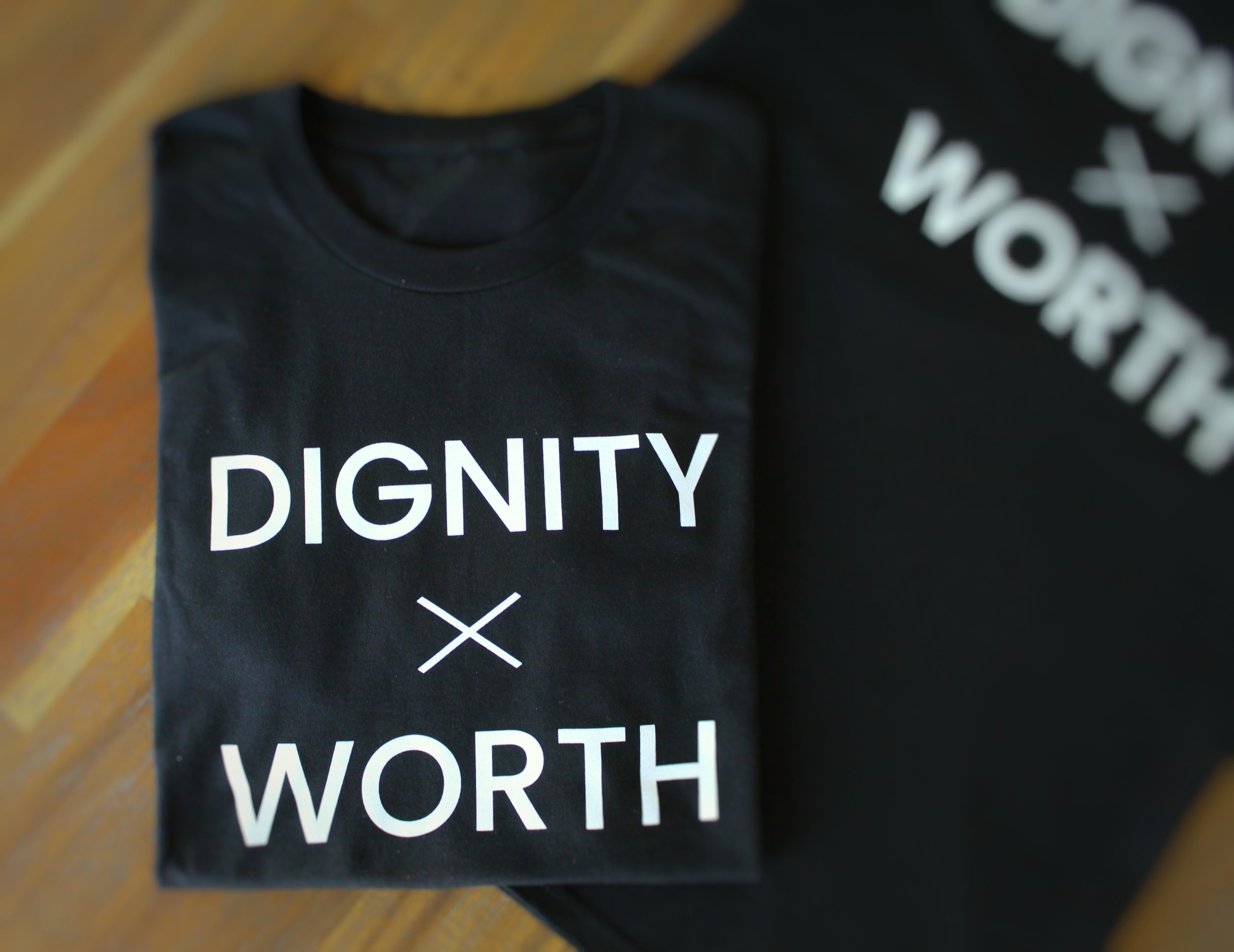 DIGNITY x WORTH Classic Womens Shirt Black folded on table
