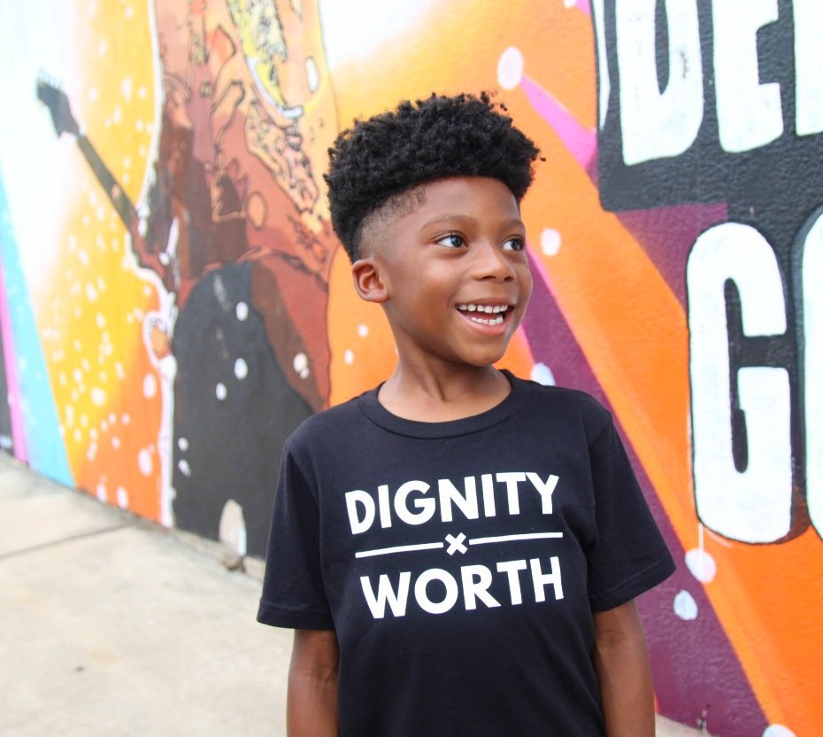 Little boy wearing black DxW Youth Classic Shirt