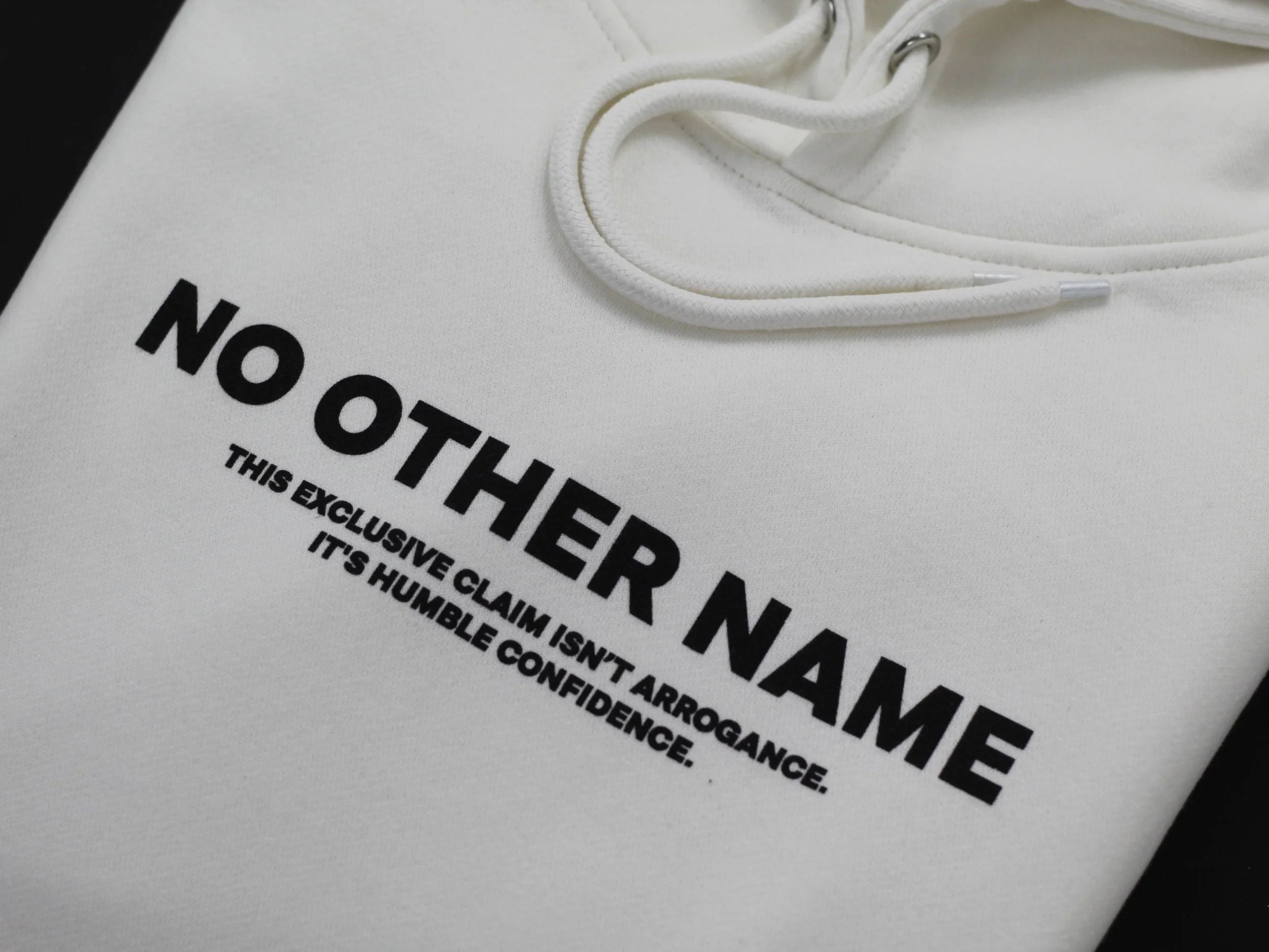Close‑up of Acts 4:12 inspired design on NO OTHER NAME Christian hoodie