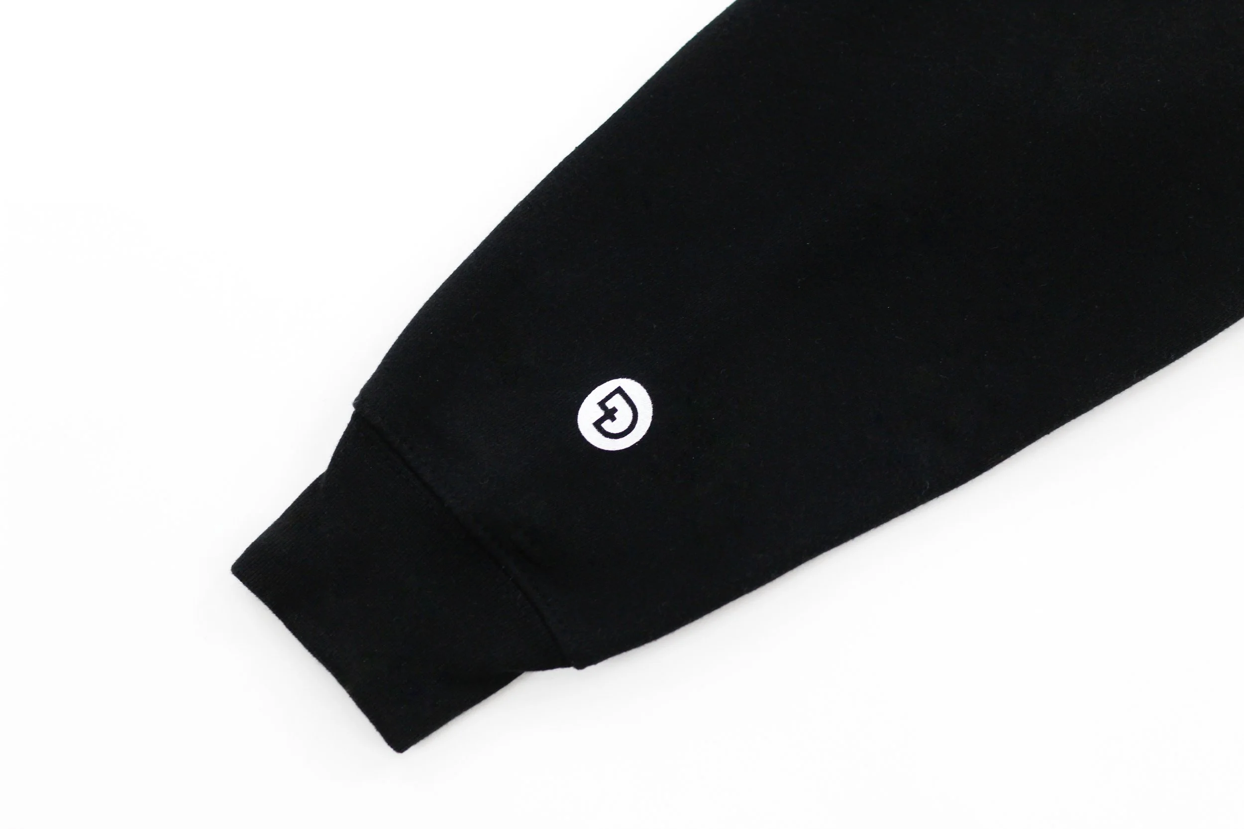 DIGNITY x WORTH logo on sleeve of black GRATITUDE premium hoodie