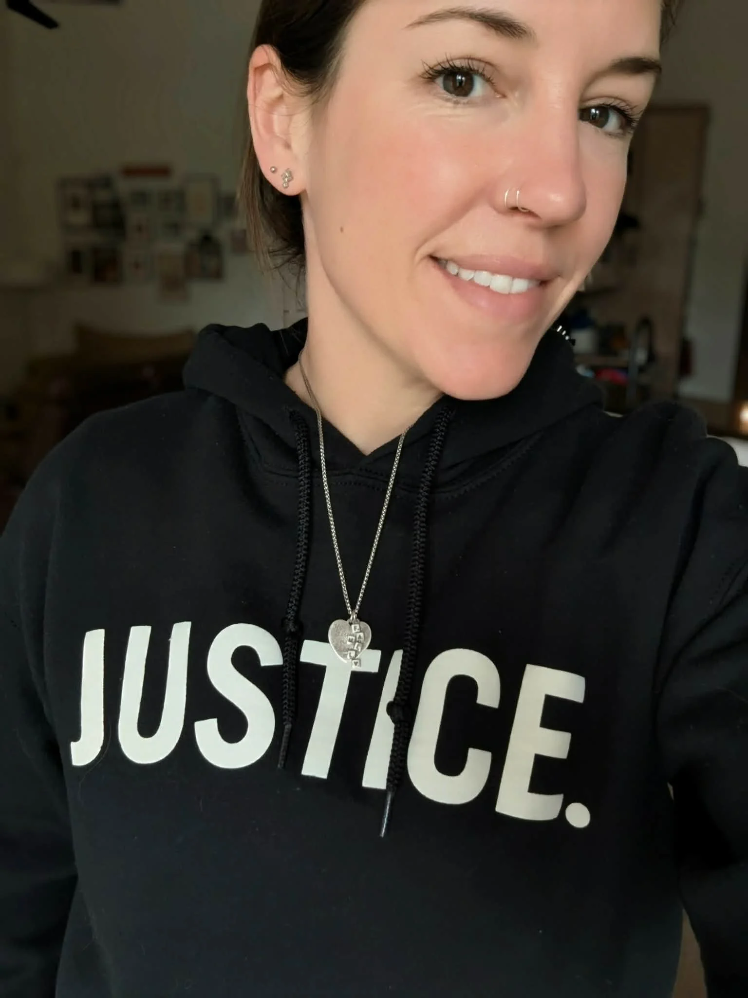 Woman in Black premium Christian JUSTICE hoodie.
