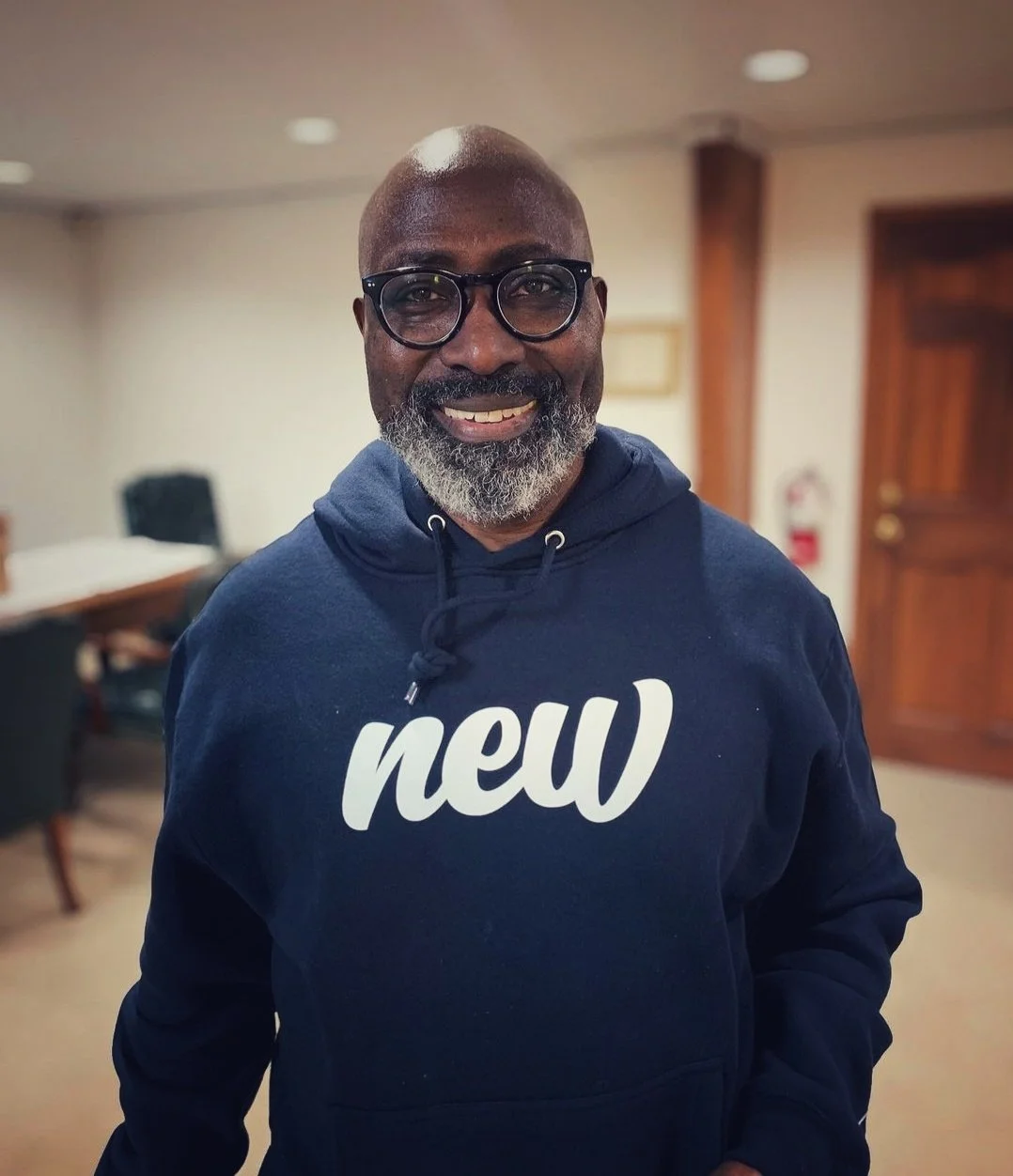 Man  posing in deep sapphire "new" premium hoodie