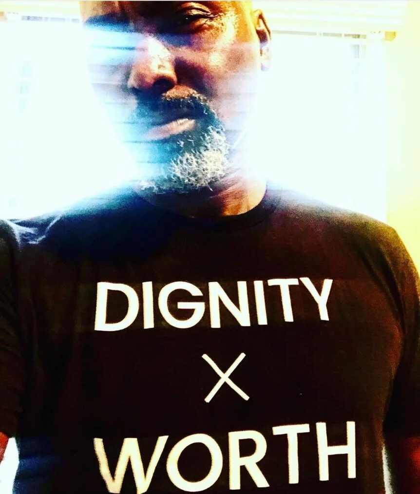 Man in DIGNITY x WORTH Shirt