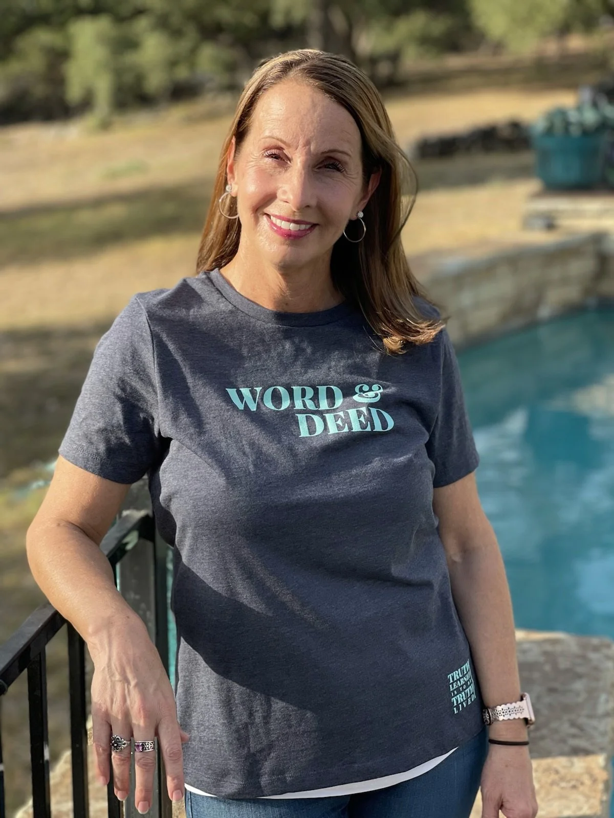 Woman in women's WORD & DEED shirt