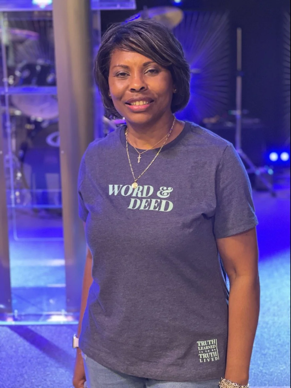 Woman in women's WORD & DEED shirt