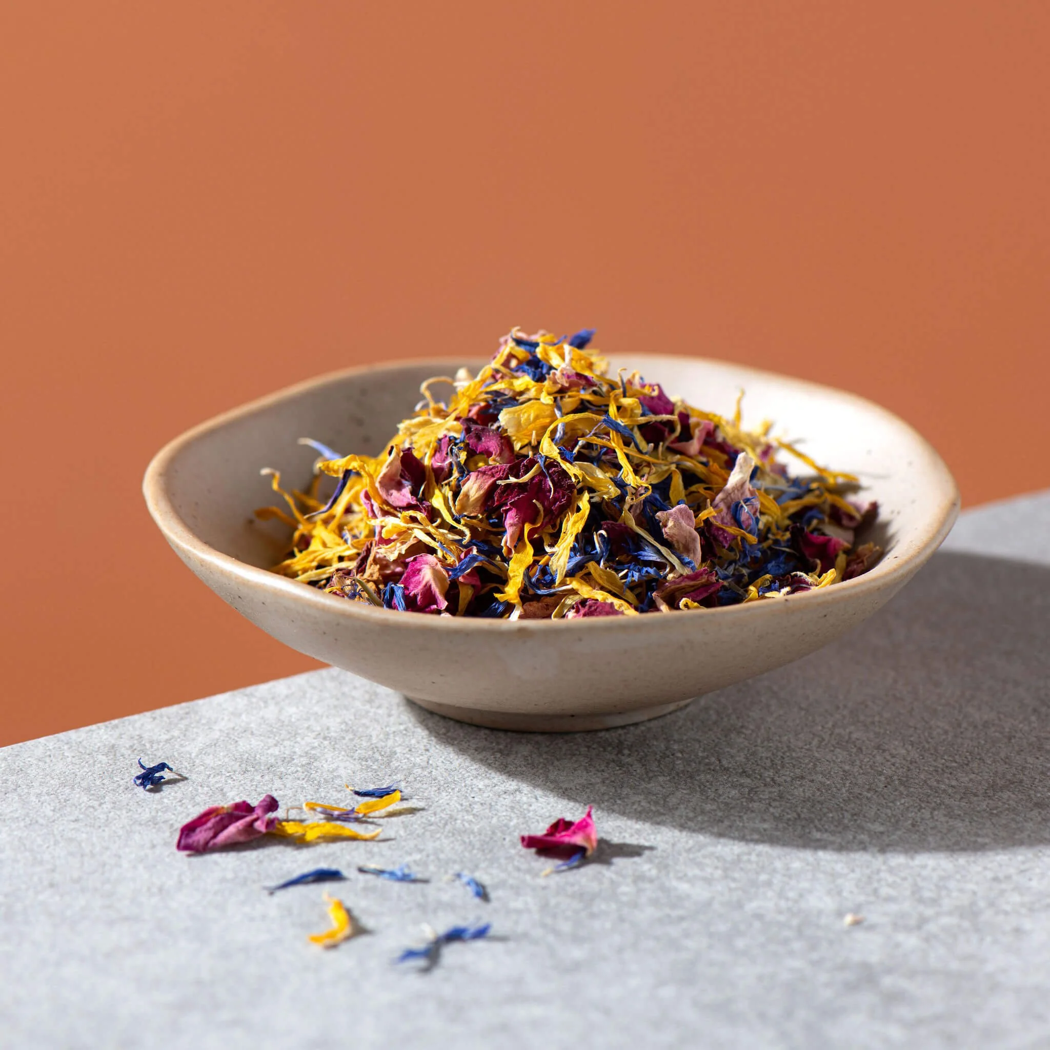 Rose petals calendula petals and cornflowers in a small bowl