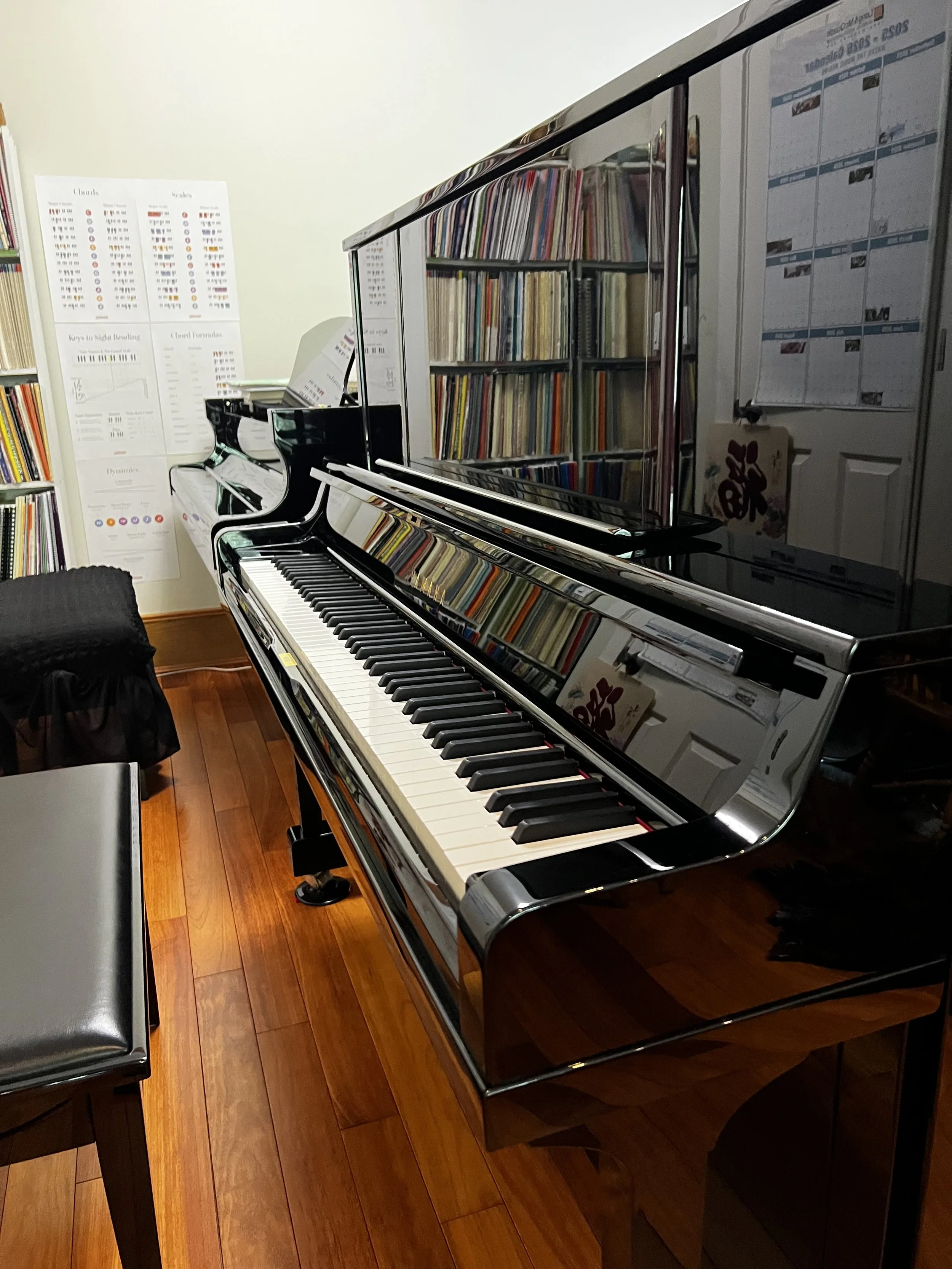 two beautiful pianos in the studio, Yamaha upright and Heintzman grand