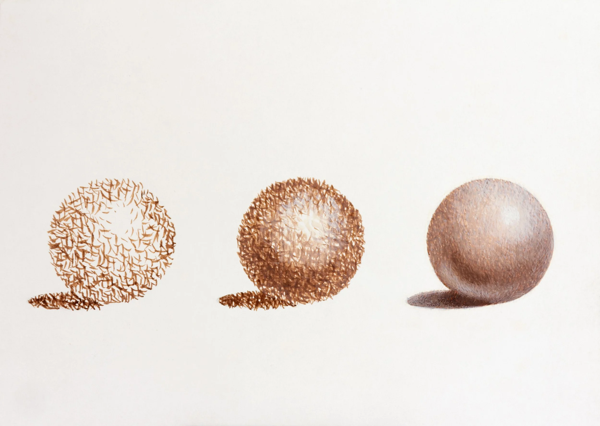 Three decorative spheres with different textures and patterns, placed on a white surface.