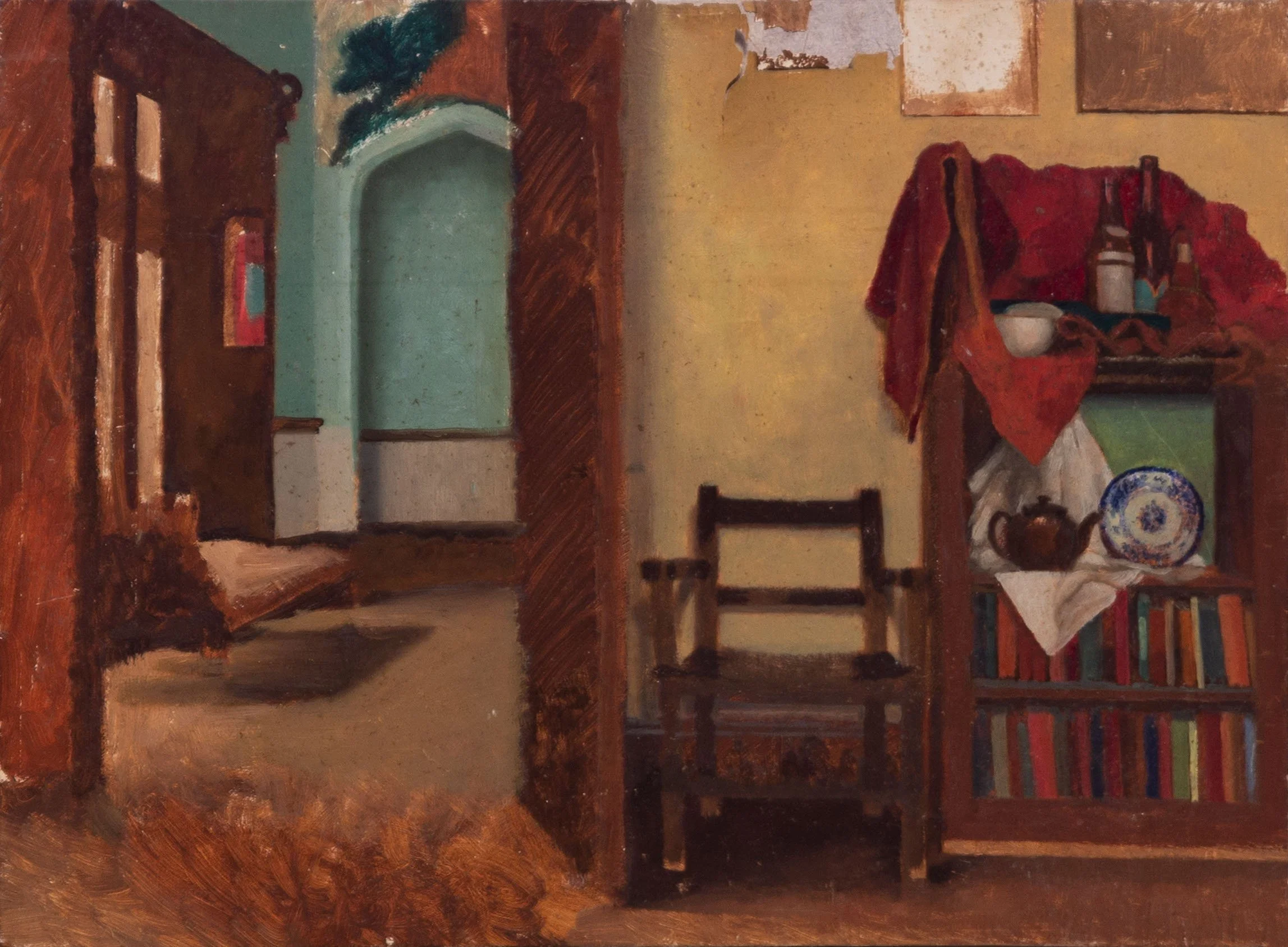 An interior scene with a fireplace, a small dining table covered with a red cloth, and shelves containing bottles and dishes. Walls are decorated with abstract paintings and a bookshelf filled with books.