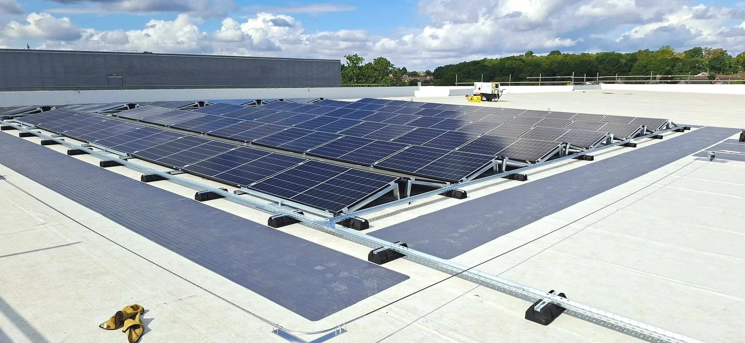 Kingspan Topdeck insulated roof panels featuring IKO Armourplan PVC Single-ply waterproofing membrane