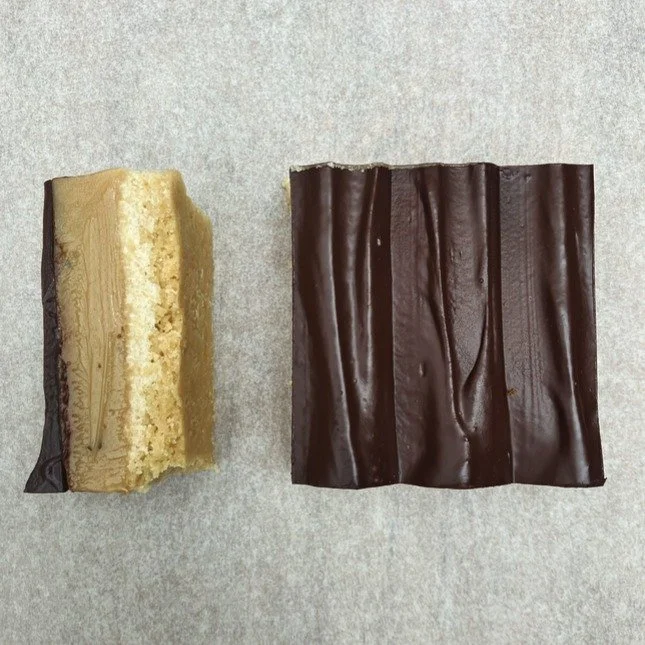 CAKE OF THE DAY 

ROSEMARY MILLIONAIRES CARAMEL SLICE

Tired of the same mass produced cakes? Elevate your coffee shop's offering with our Millionaire Caramel Shortbread&mdash;a slice so rich, some of our partners call it the Billionaire's Slice.

Th