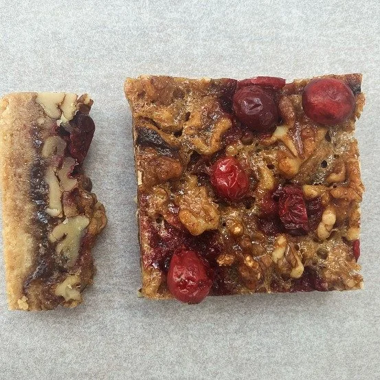 CAKE OF THE DAY

CRANBERRY &amp; WALNUT SLICE

Great for the festive season though we have this on the menu all year around. Otherwise there'd be a riot!

Bitter walnuts and picant cranberries on our signature all butter biscuit base. Our riff on the