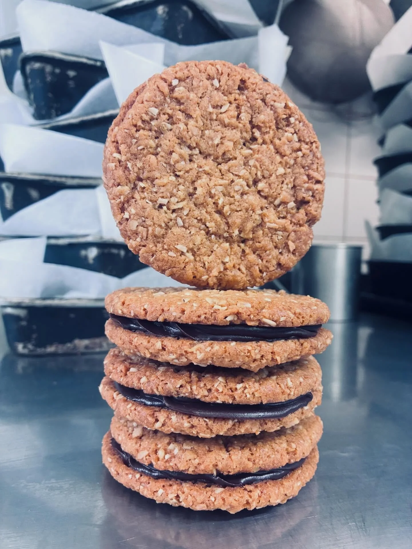 The first of two SE bakes for LCF26.  Two of our deliciously buttery Anzac cookies sandwiched together with dark chocolate ganache.  Al thinks they&rsquo;re perfectly decadent enough though I&rsquo;m all up for adding some salted caramel.  Do we want