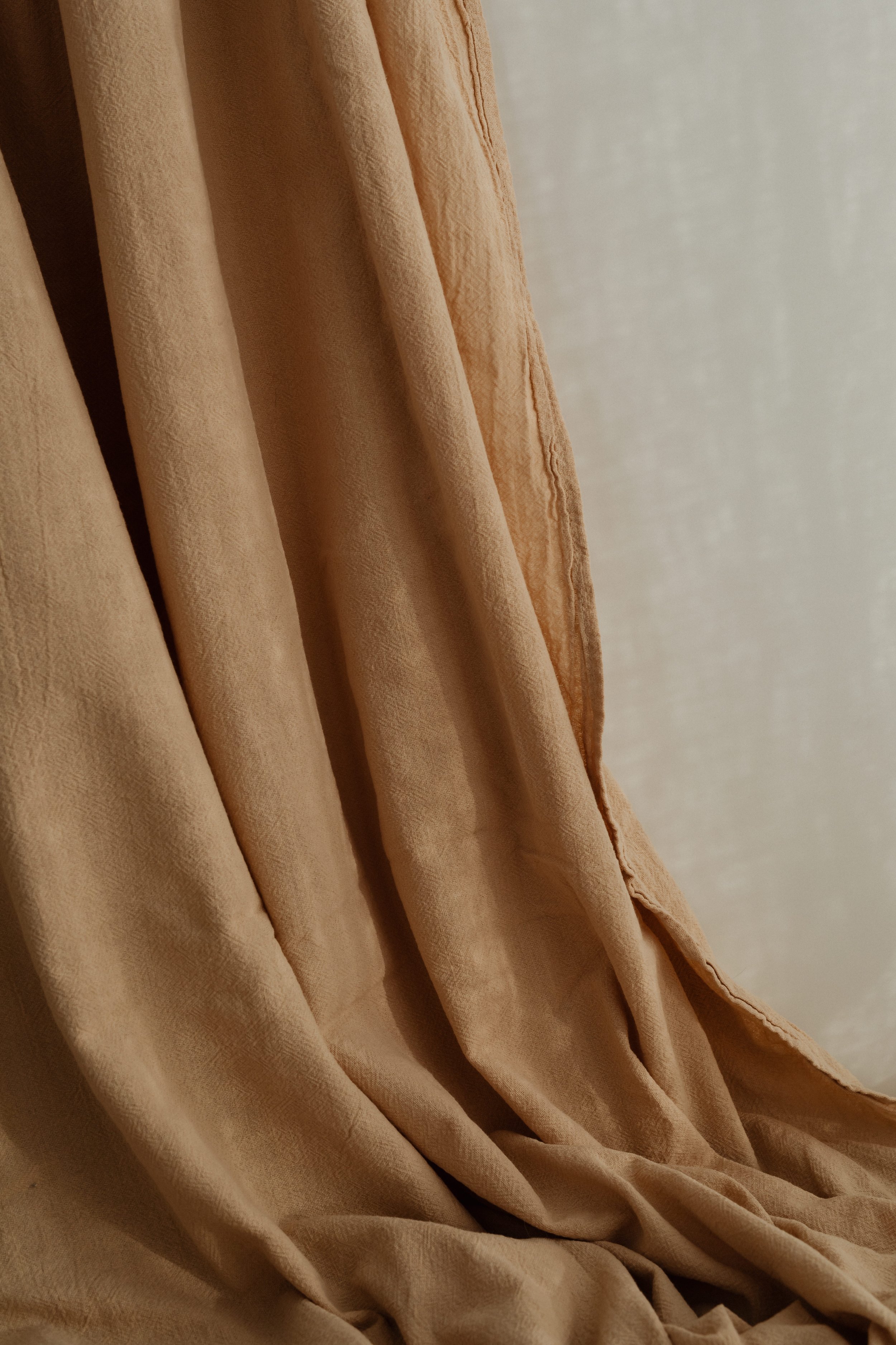 kaboompics_wrinkled-curtain-in-beige-or-brown-color-28872.jpg