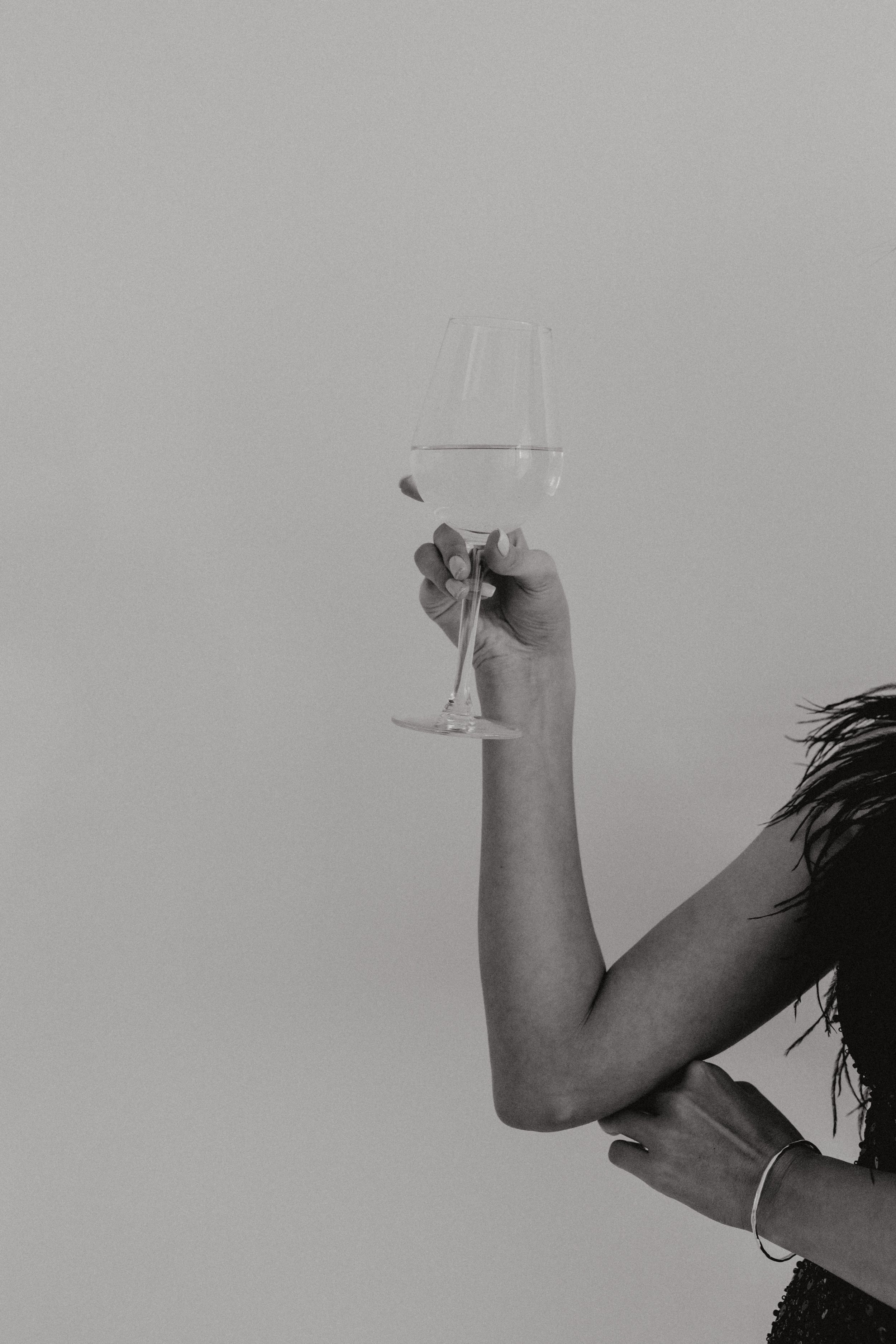 kaboompics_classy-aesthetics-beautiful-asian-woman-in-black-evening-dress-white-wine-in-a-glass-29509.jpg