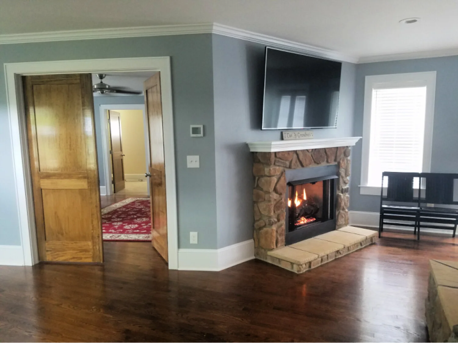 Natural Stone Fireplace completes this cozy Family Room Renovation.