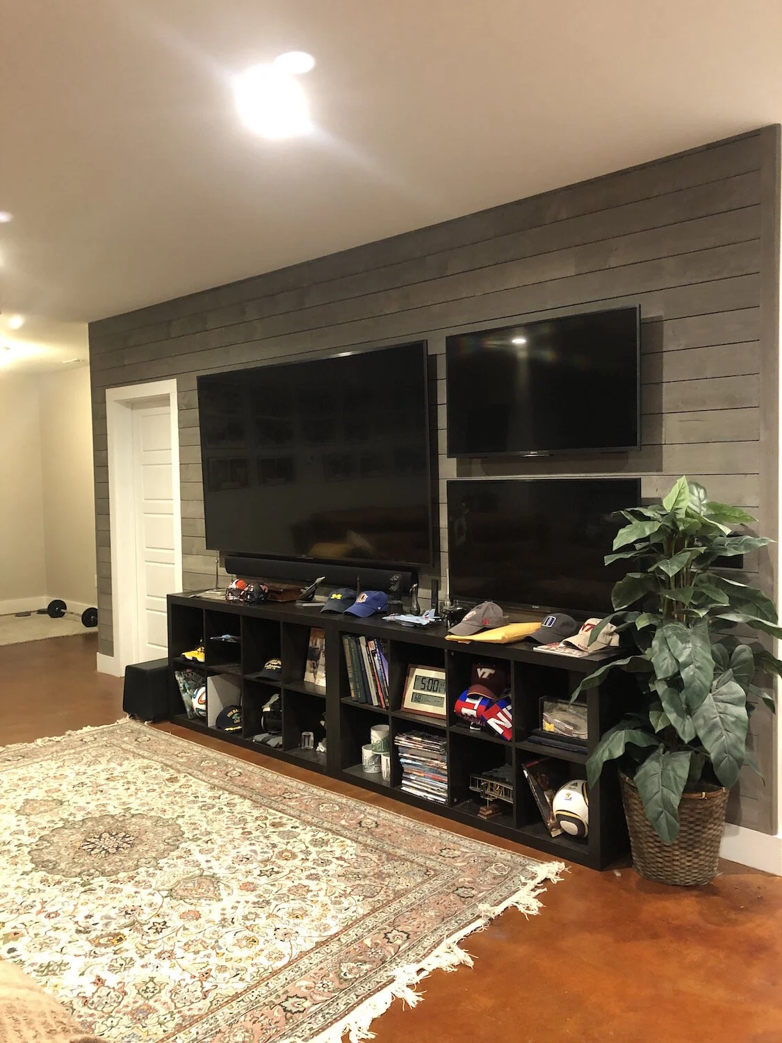 Custom Basement Design & Renovation with grey shiplap accent wall.