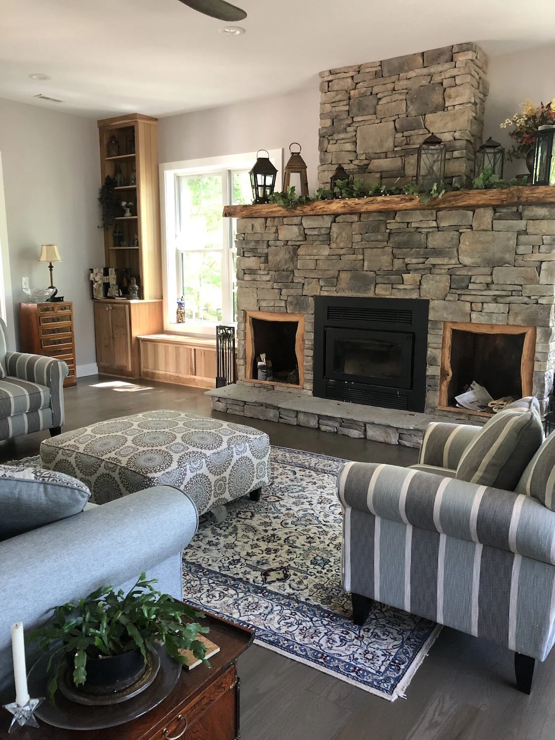 Natural Stone fireplace and Cedar wood trim for this cozy Family Room Renovation.