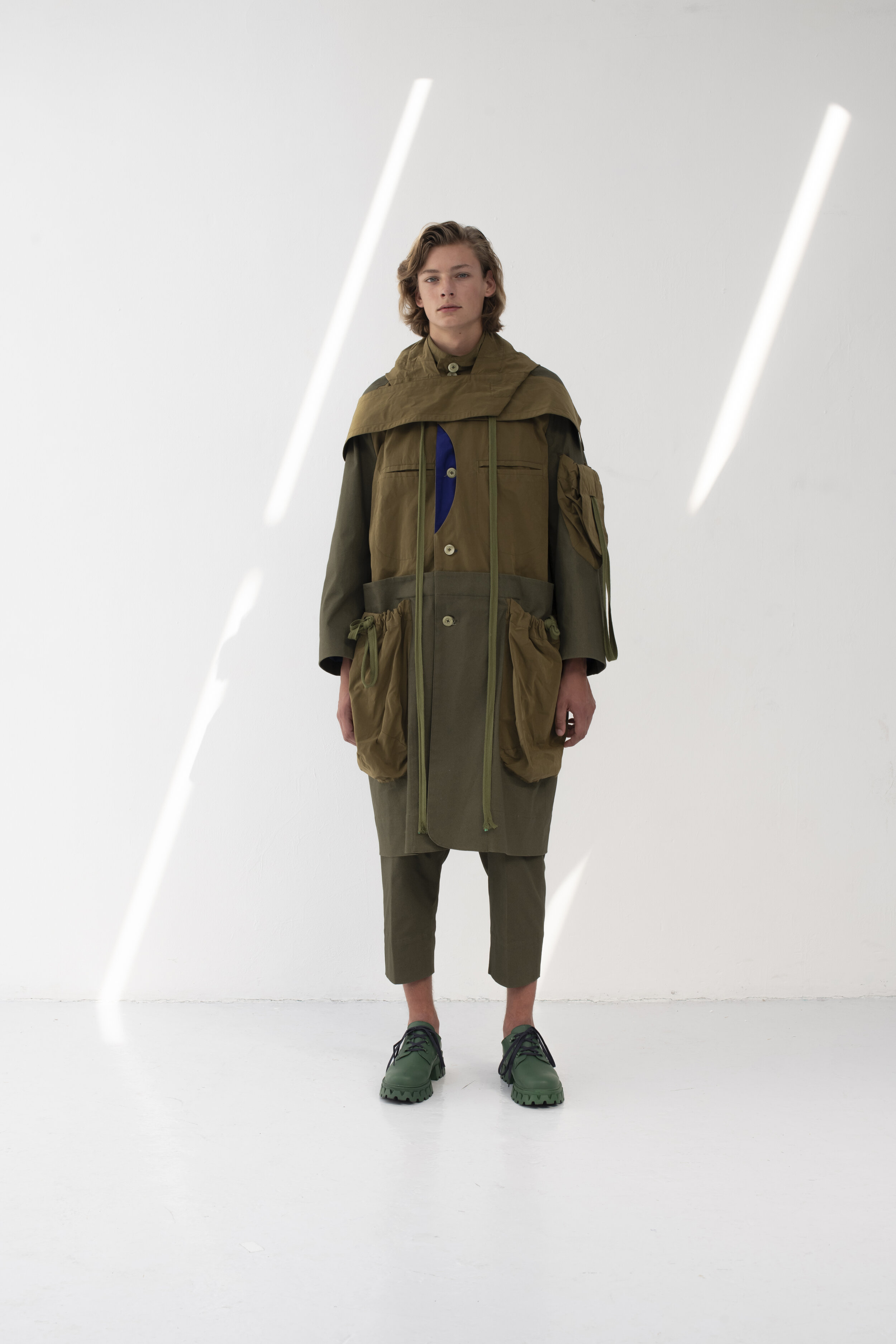 Kneelength hooded coat with multiple pockets