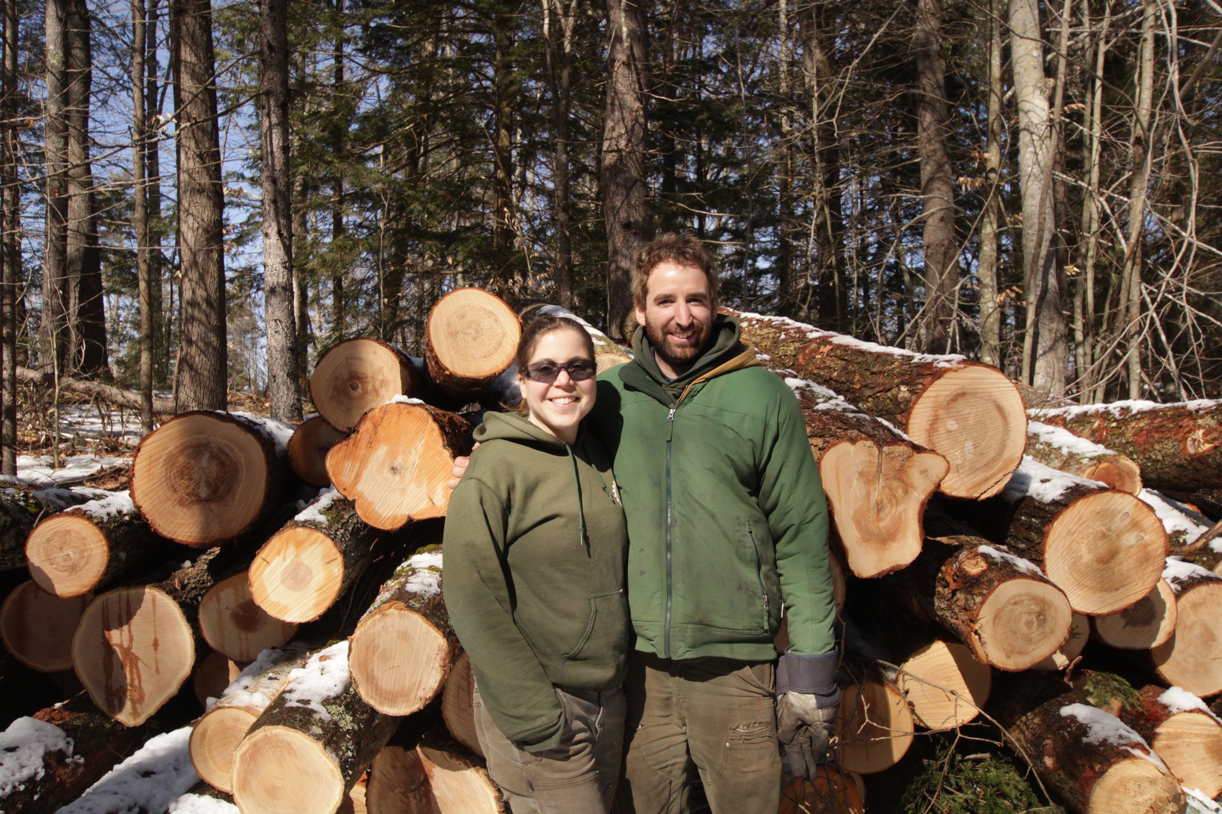 owners Miles and Katrina on a logging job in Durham, NH