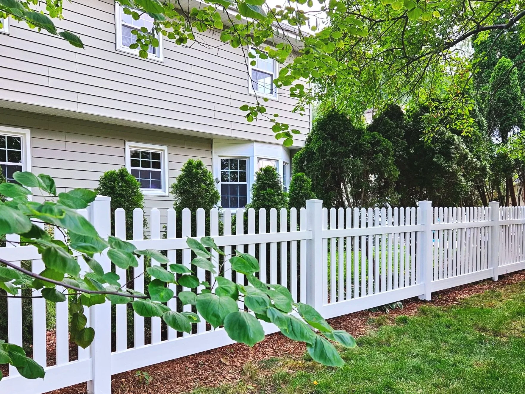 Straight top dog ear vinyl picket fence in Naperville, IL