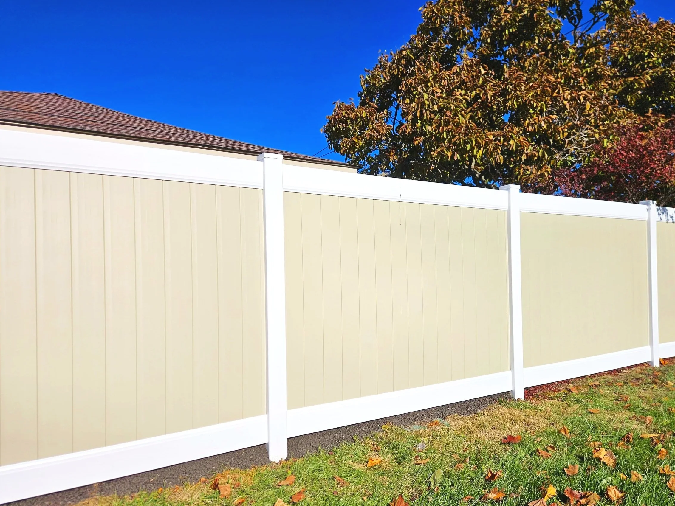 Two tone vinyl privacy fence in Plainfield, IL