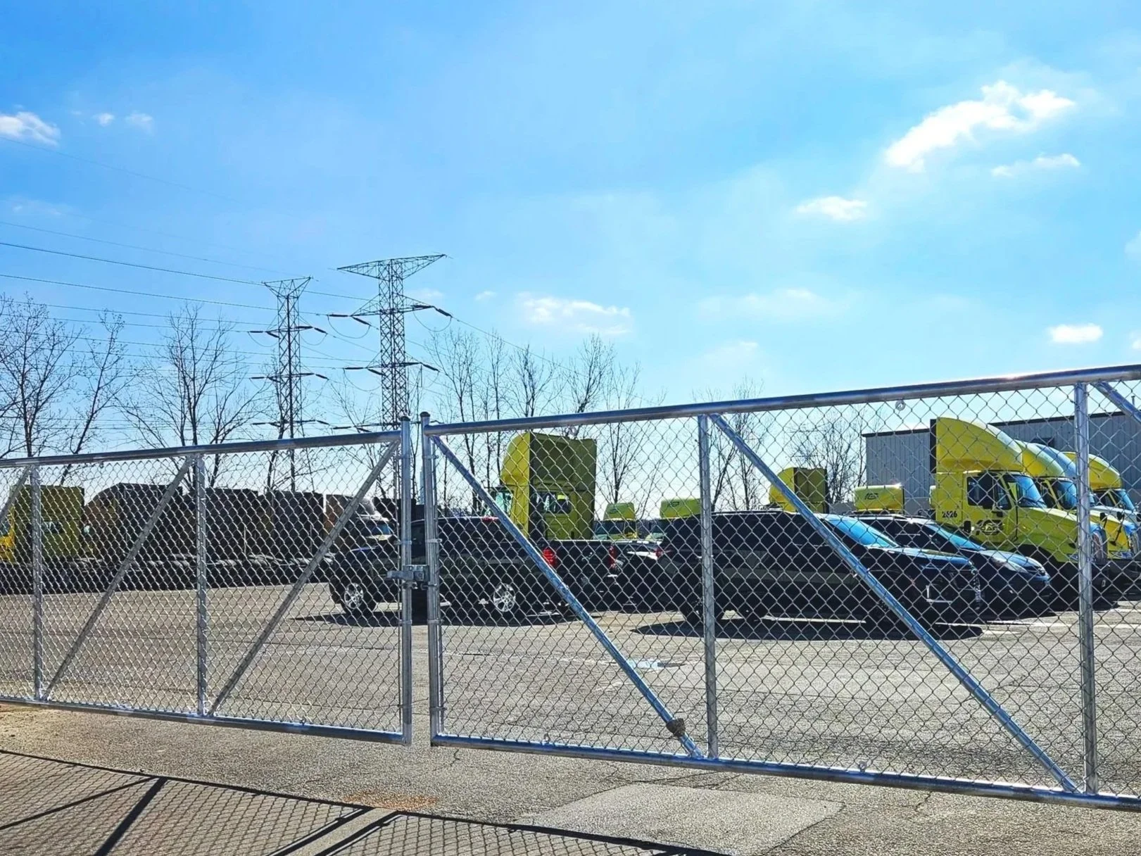 Cantilever galvanized chain link double gate for a 30 foot opening at 10 Roads Express in Romeoville, IL