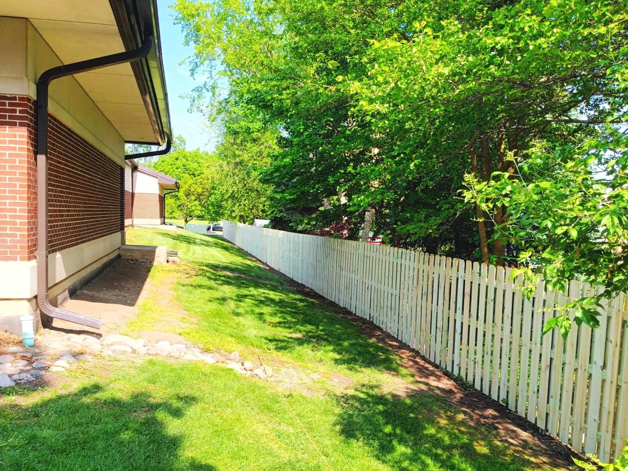 Naperville Public Library, Naper Boulevard Branch, treated pine shadowbox with galvanized steel posts fence