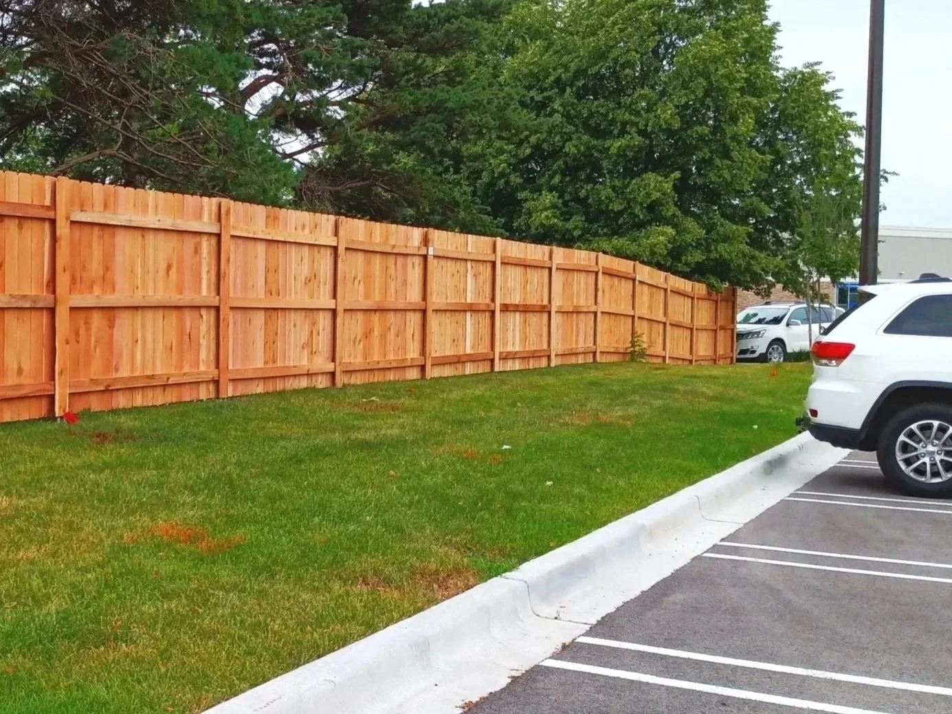 Red cedar privacy with galvanized steel posts fence at Costco Wholesale on Ogden Ave in Naperville, IL