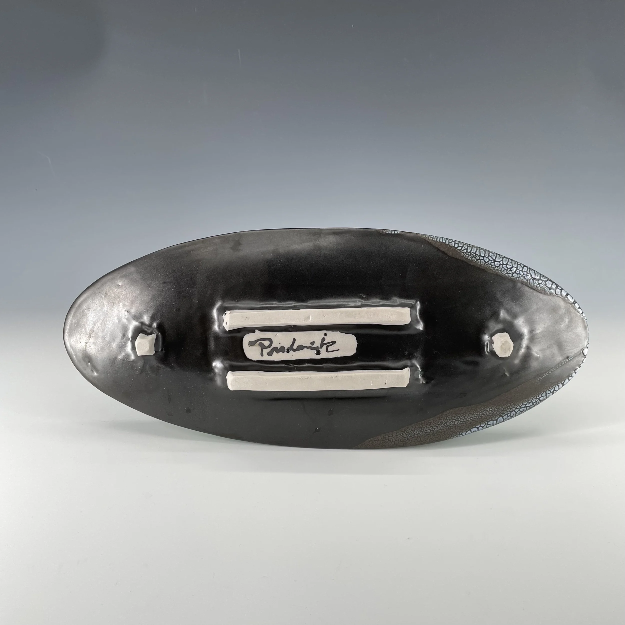Black and crackle oval platter bottom