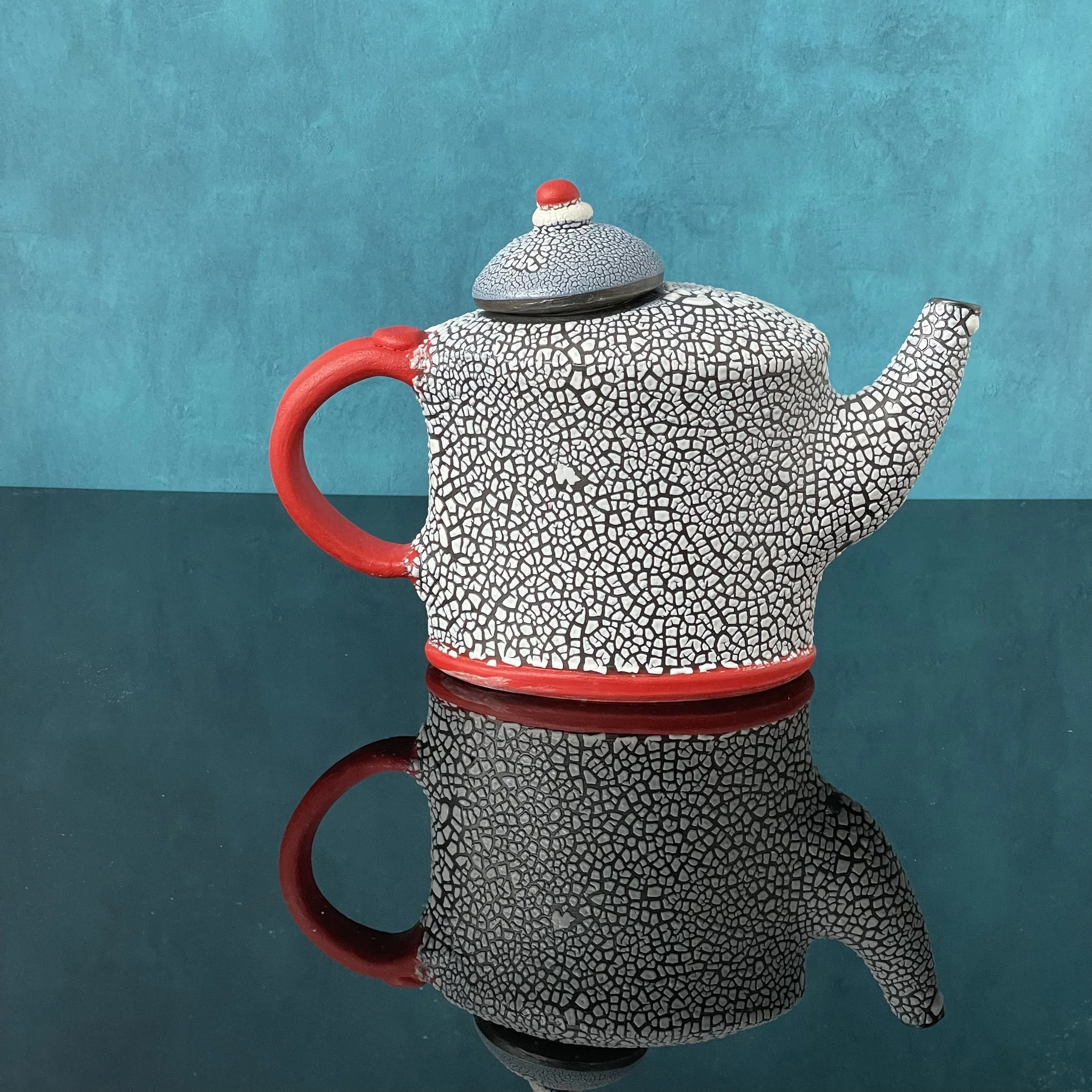 Red handled teapot