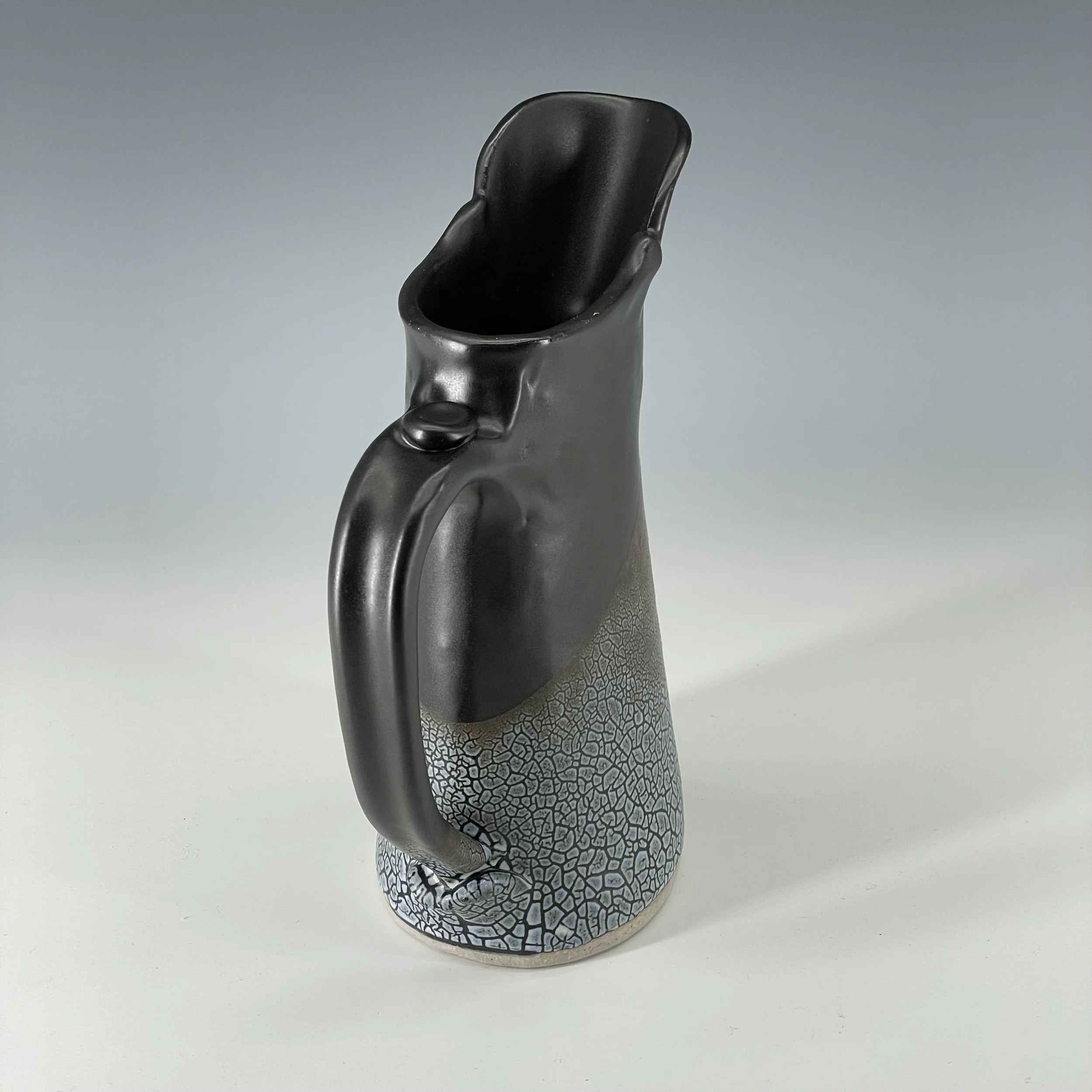 Black and crackle pitcher handle detail