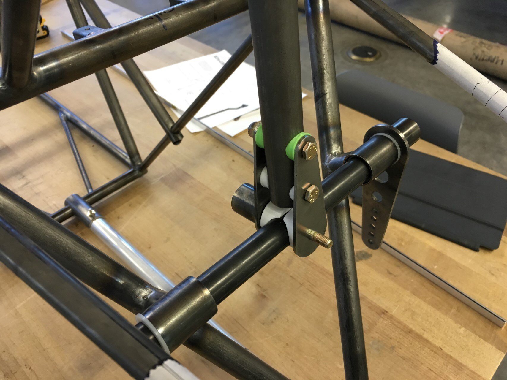   Elevator control stick torque tube installed with control stick and elevator control horn attached. The 3D printed saddles are temporary until we machine the the real parts from aluminum.  