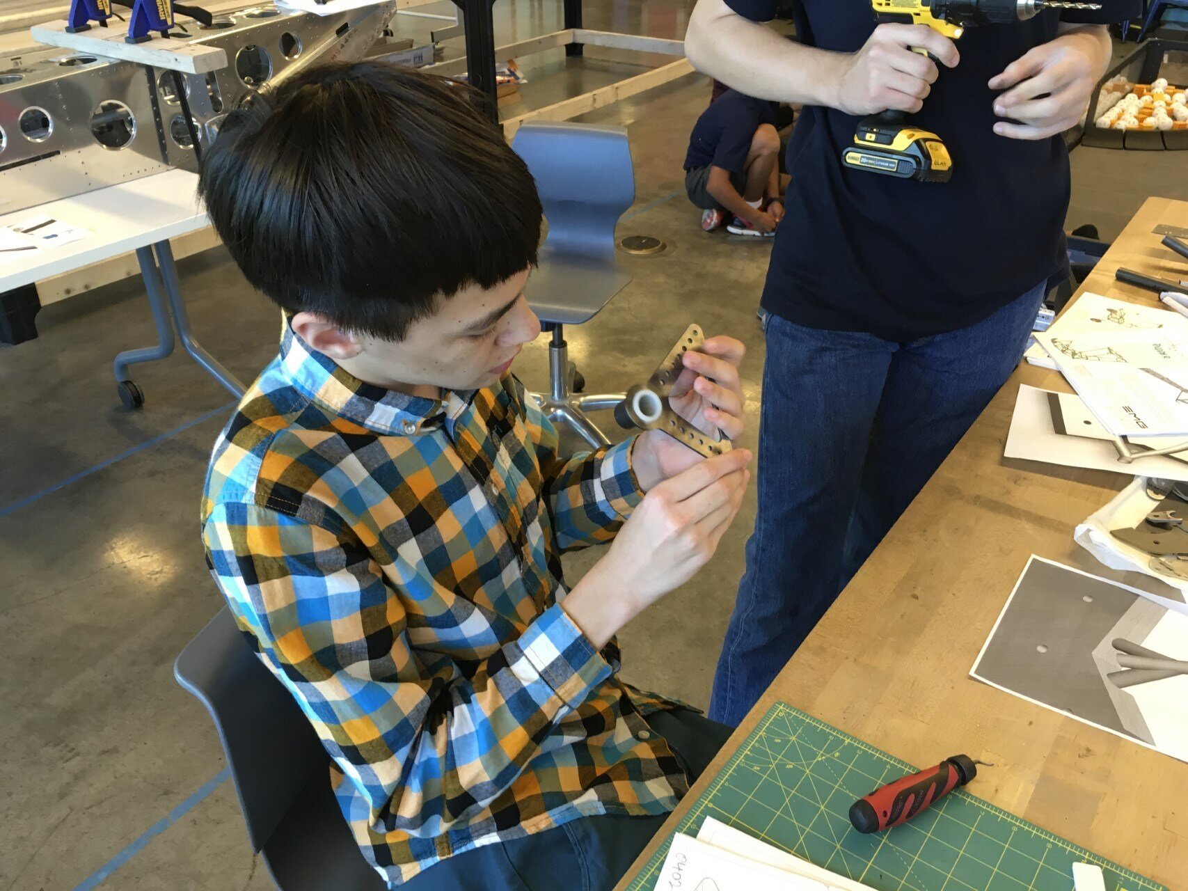   Enlarging and deburring the holes in the elevator bellcrank.  