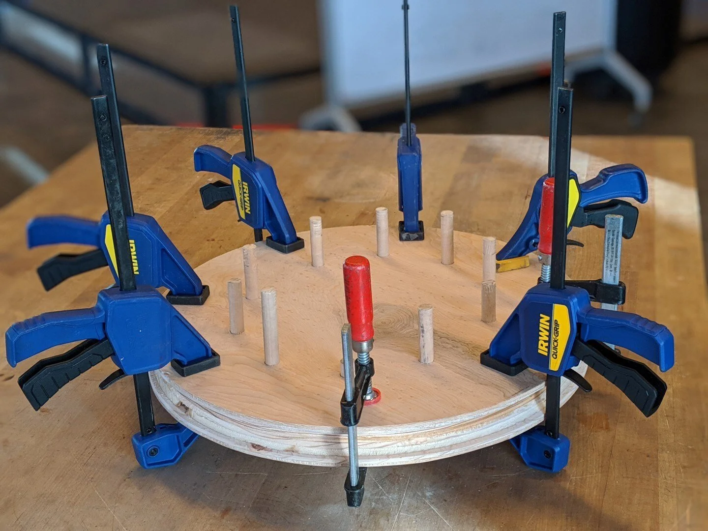 The two halves are aligned with the dowels, glued, and clamped.