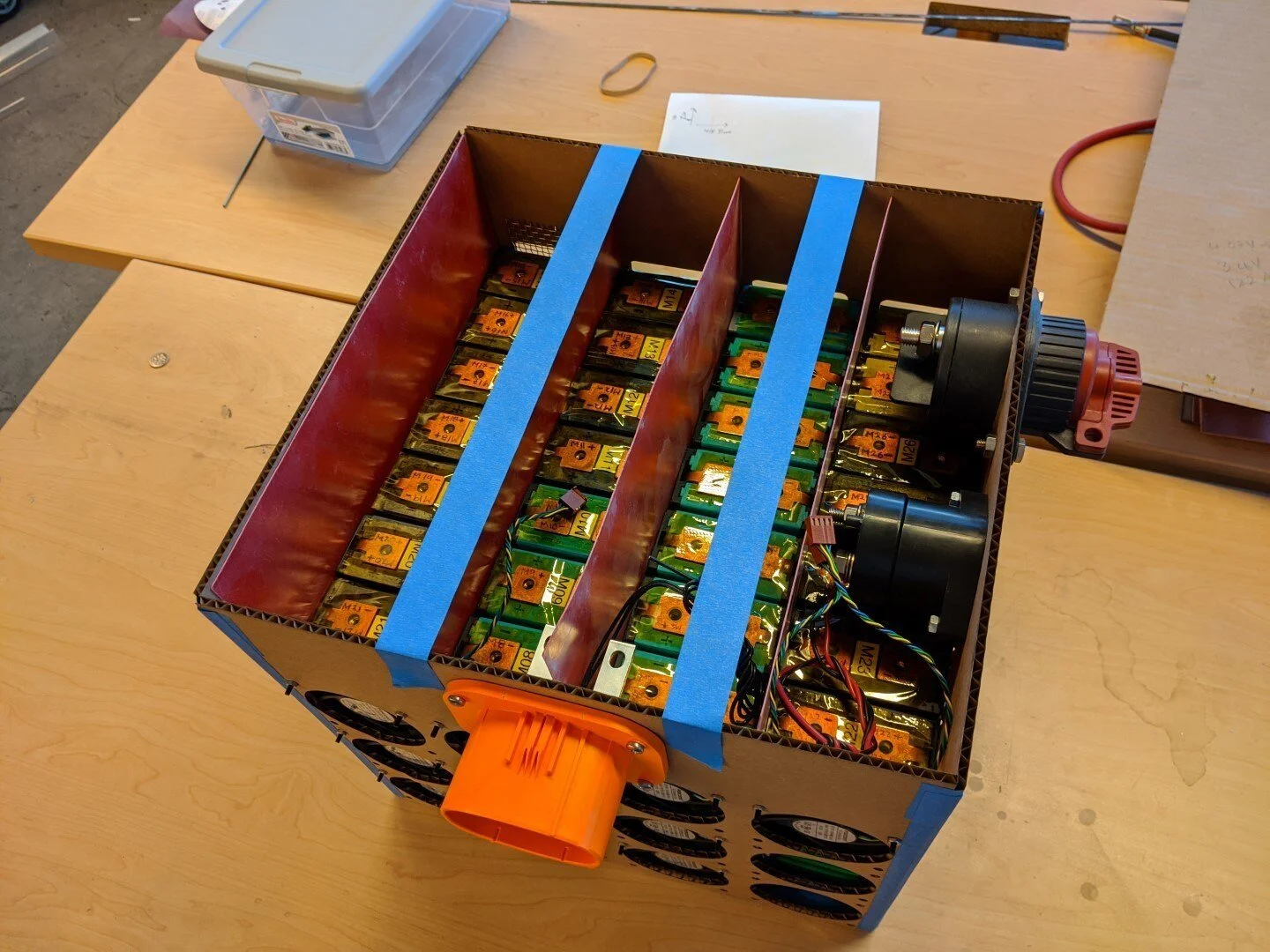 Modules installed in prototype enclosure with balance of electrical components. Each row of 7 modules will be separated with electrical grade fiberglass (GP03) sheet.
