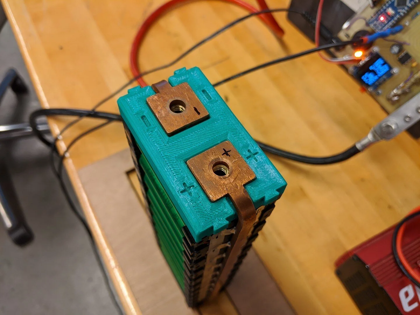 A completed battery module without the insulating side covers installed.
