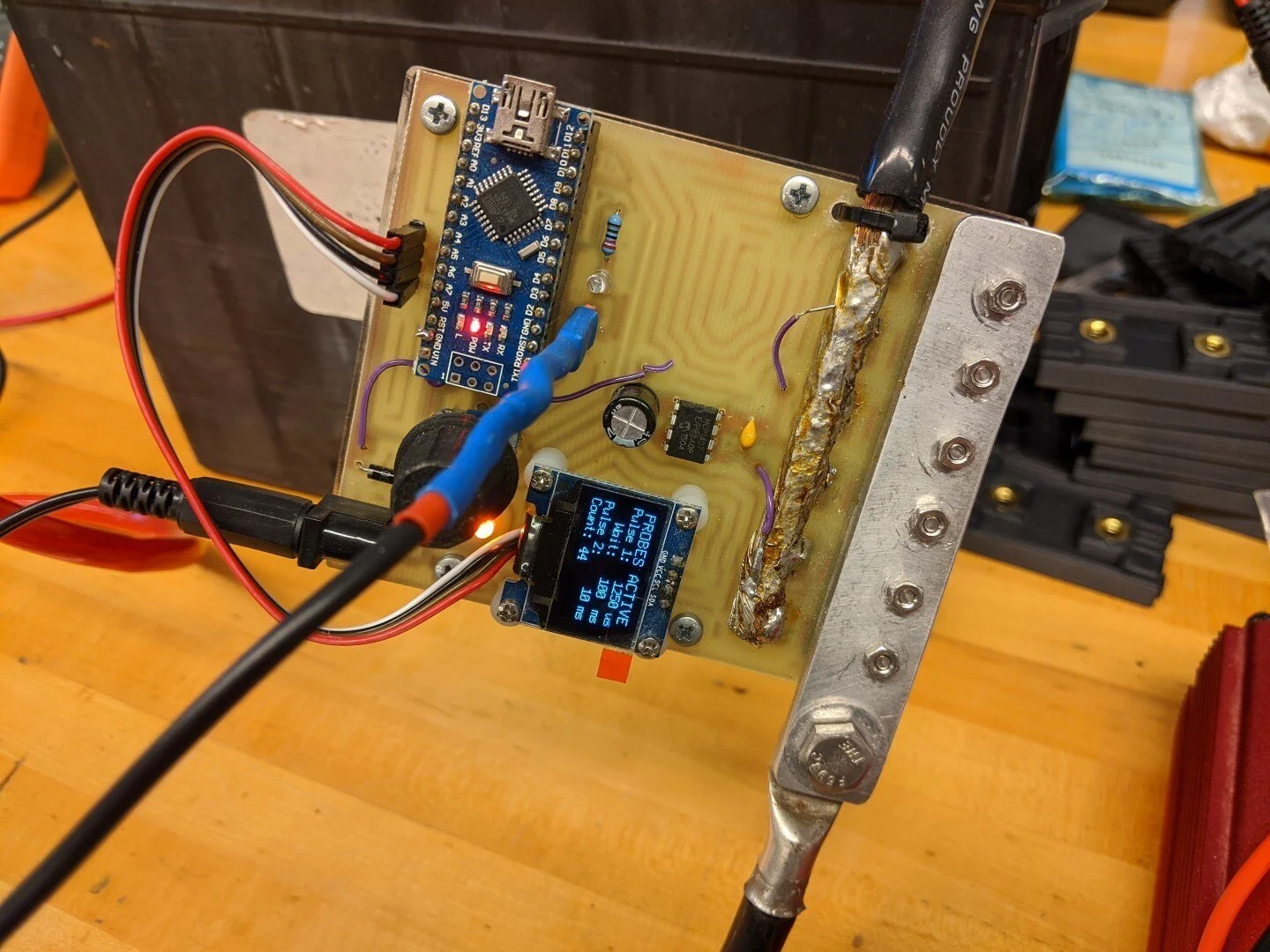 Here is our custom Arduino-driven spot welder. The pulse duration can be adjusted to optimize the weld. We used 2 deep cycle lead acid batteries as the power source.