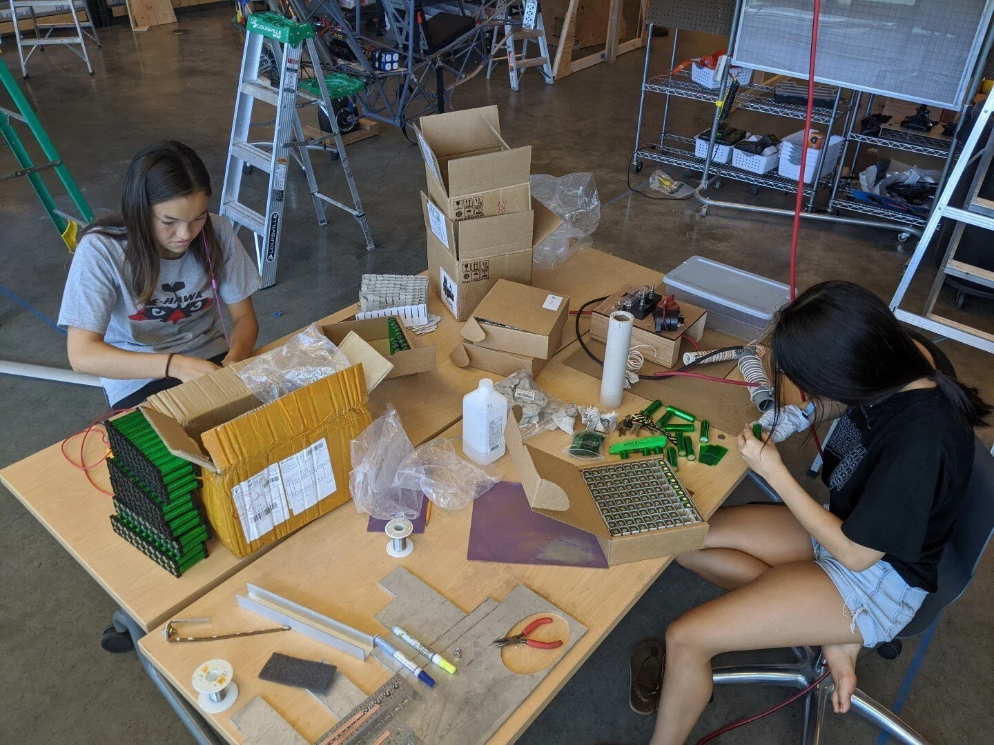 After the cells are wrapped, assembly of the modules begins. Cell holders are configured to arrange the cells in a 2 x 10 array.