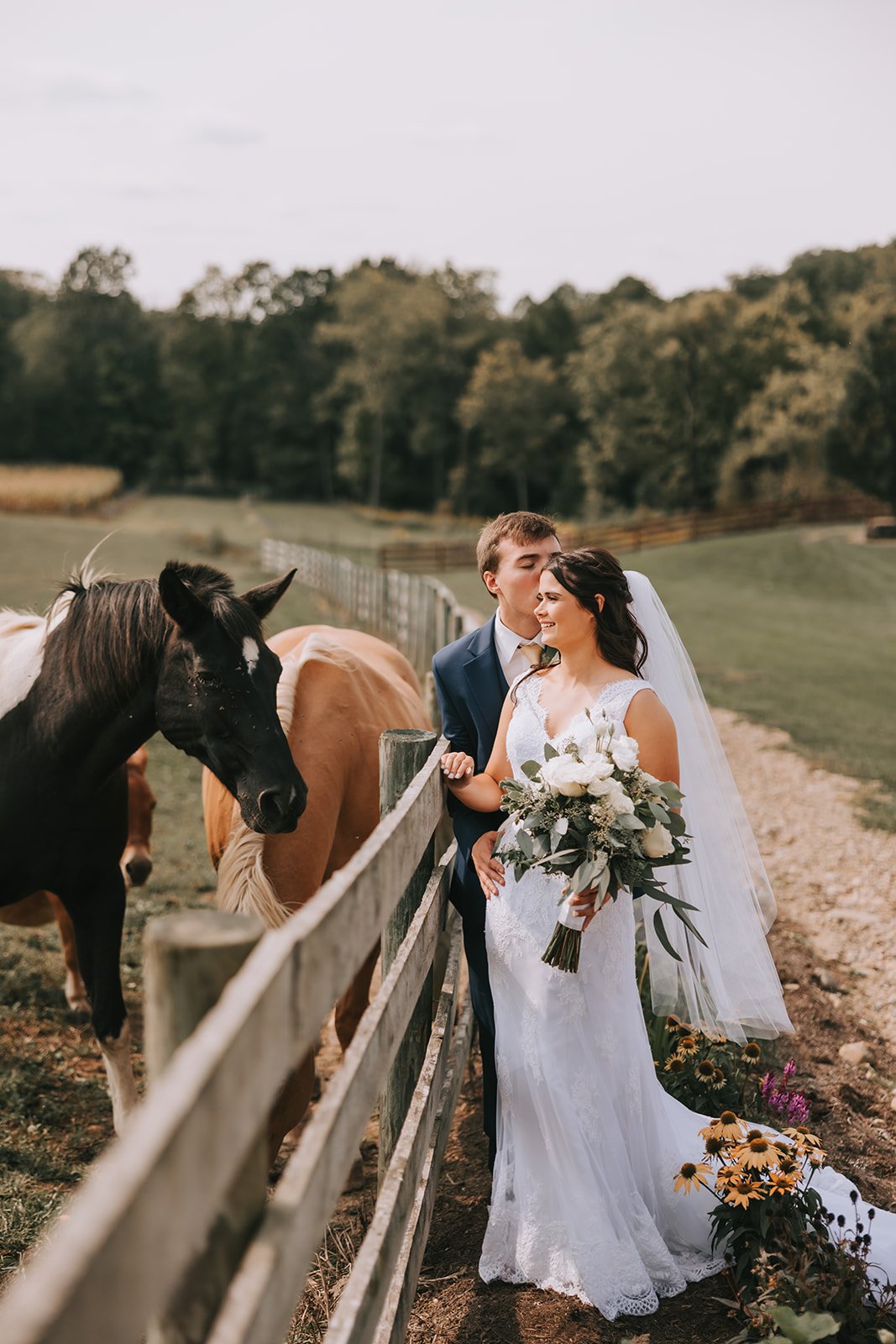 bride and groom with horses