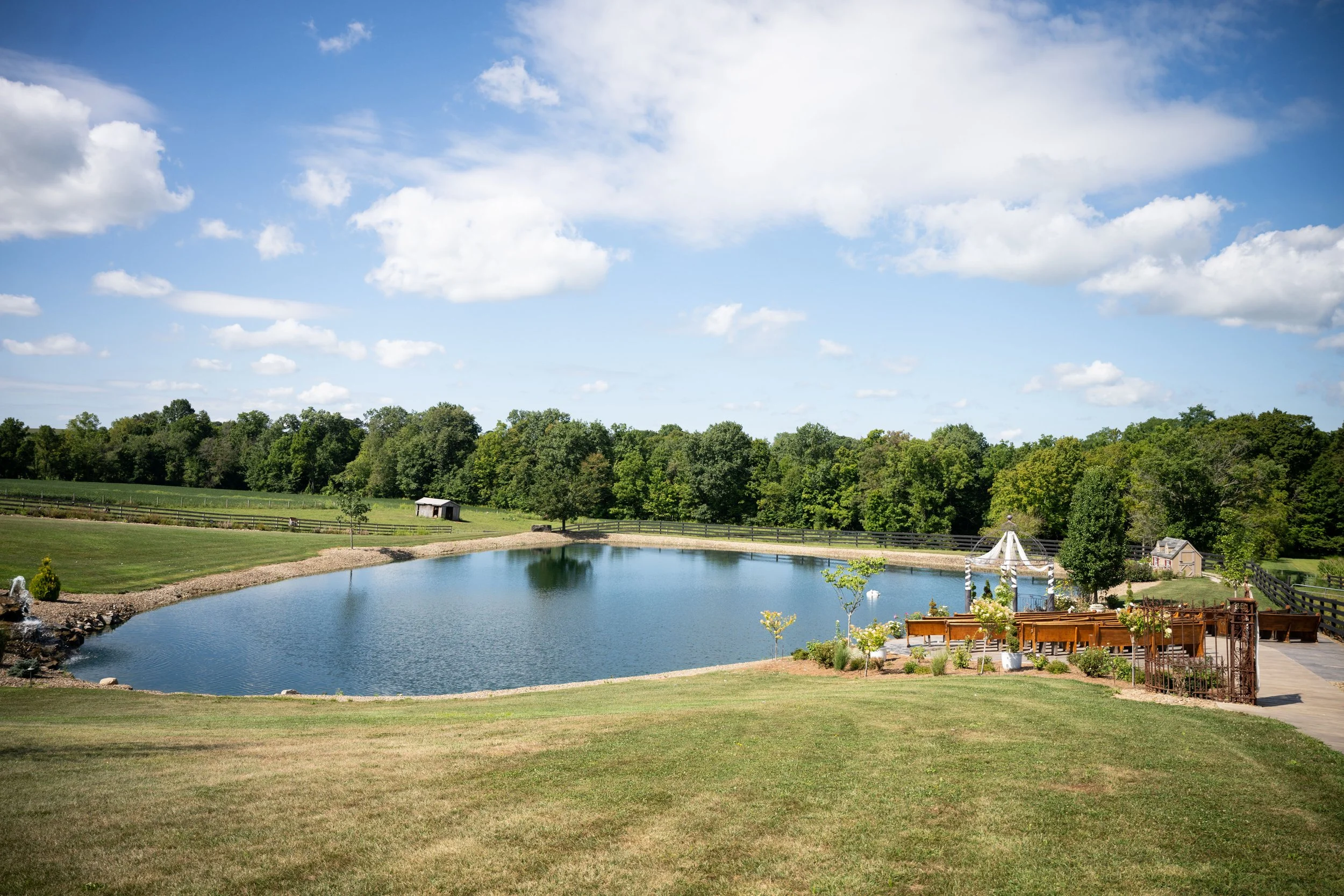 beautiful ceremony site set next to our pond  surrounded by forest