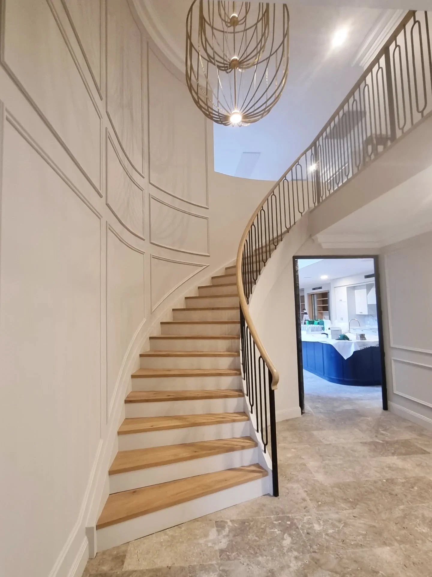 What an entrance. Beautiful curved stair for @construction_by_design