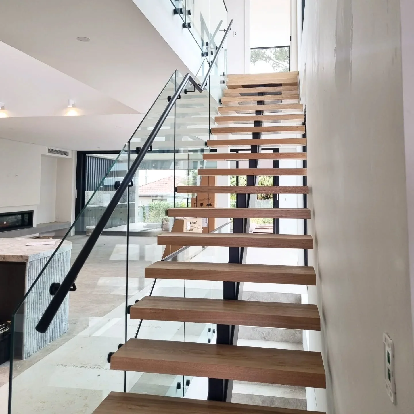 Massive Mono Stringer, 65mm Vic Ash treads and glass balustrades. Can't go wrong