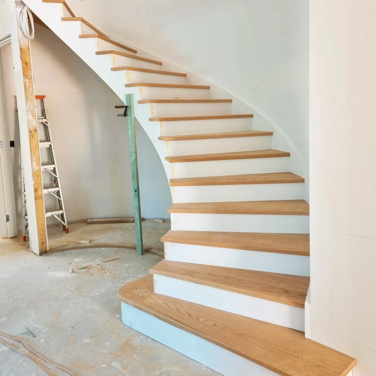 American Oak curved staircase installed. Onto the handrail in a few weeks