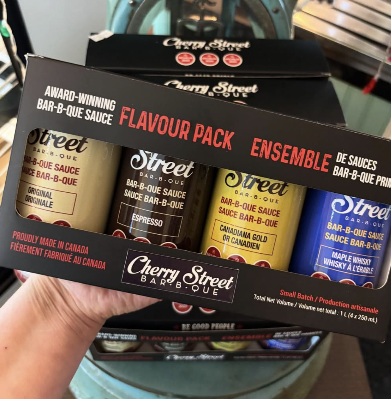 Cherry St BBQ Sauce Flavour Pack being display on hand